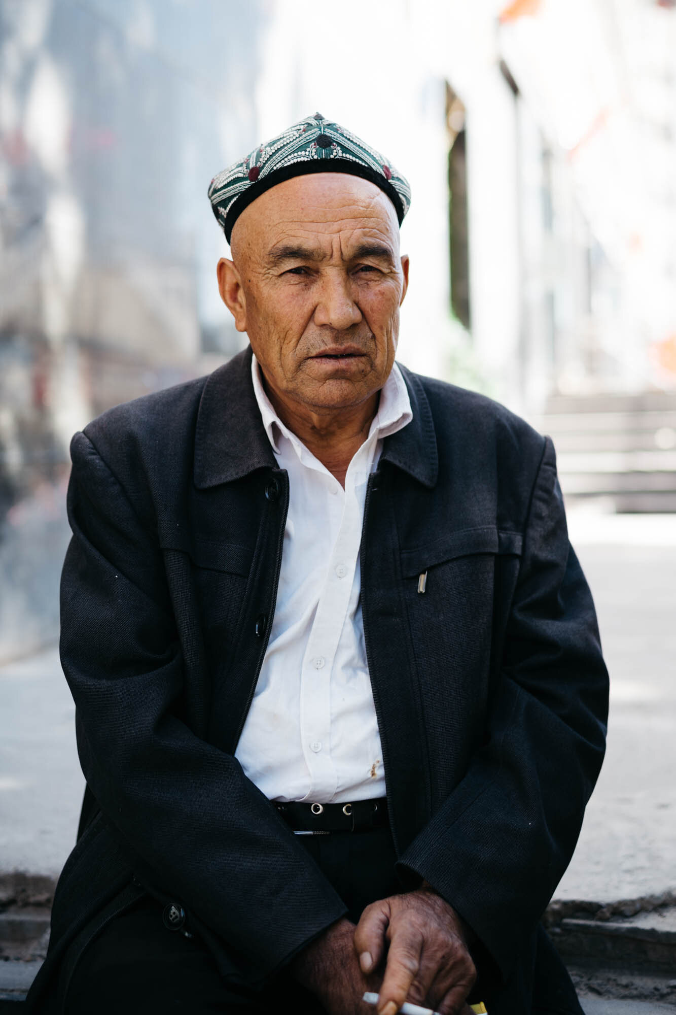  An Uyghur man wearing a traditional hat 
