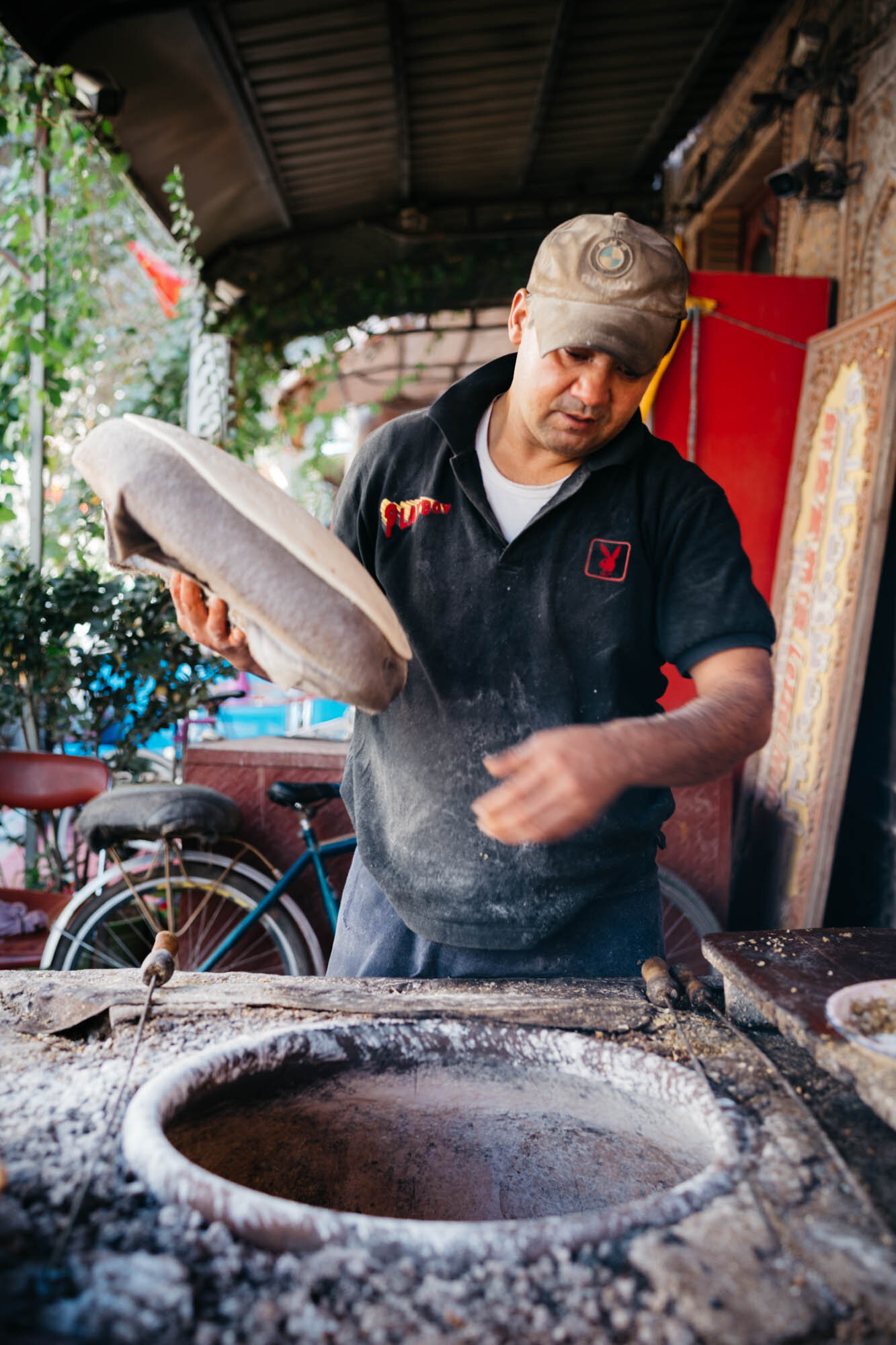  A man making traditional Tajik bread 