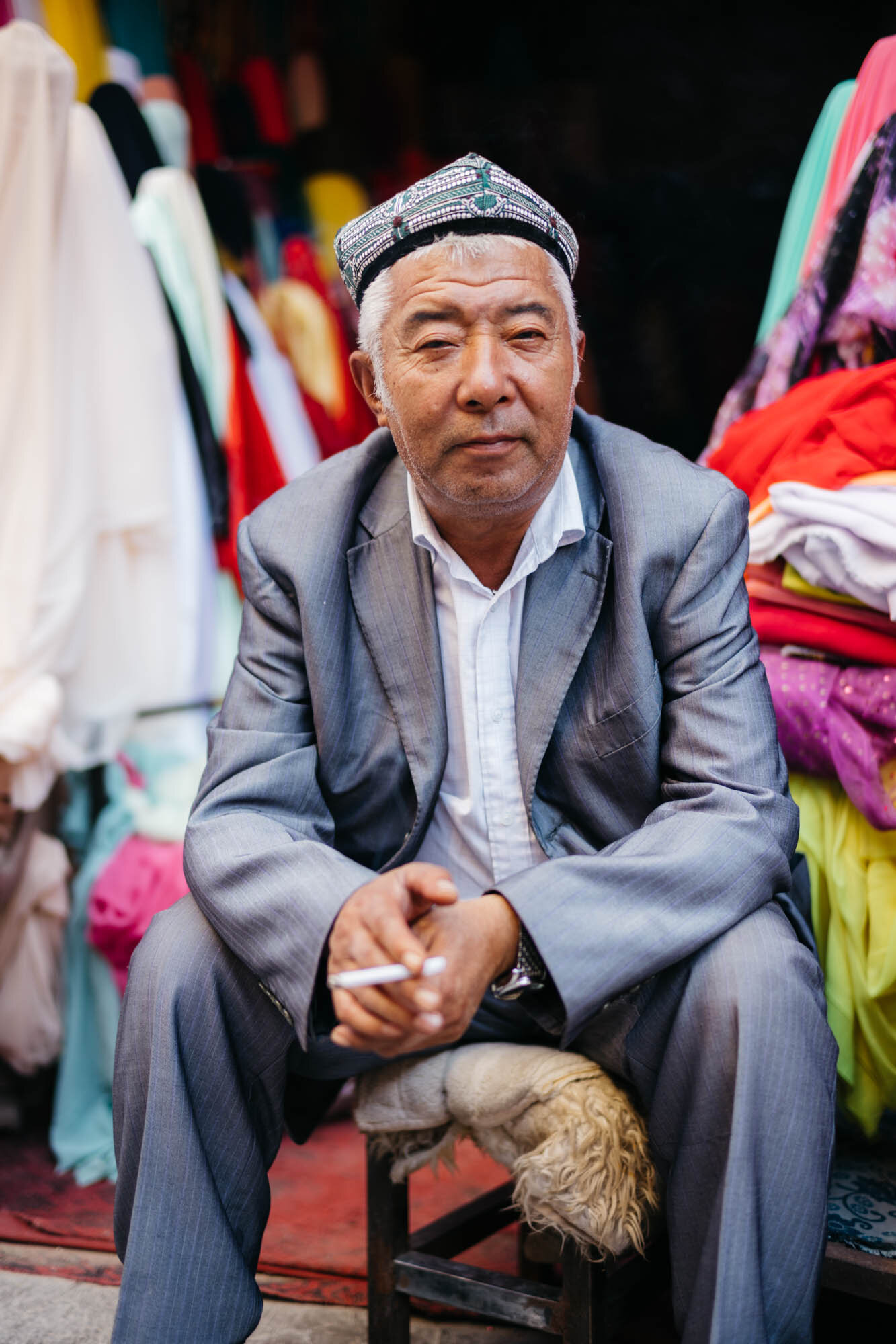 An Uyghur man in a traditional hat