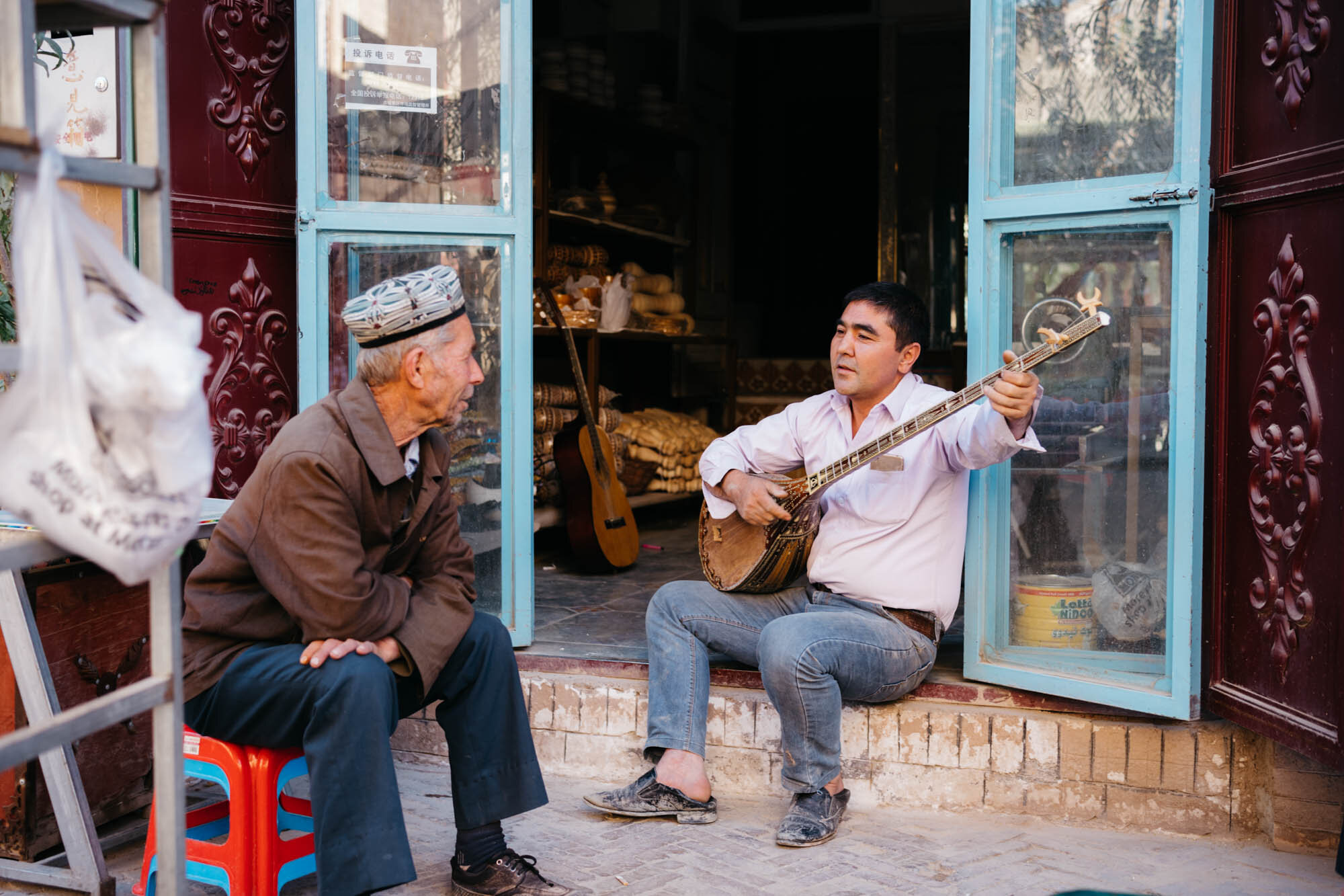  A Uyghur man playing a Dutar. Known as ‘the mother of Uyghur instruments’, the dutar is widely used at family gatherings and celebrations. ‘Dutar’ means ‘two strings’. It is the only Uyghur musical instrument played with the fingers. 