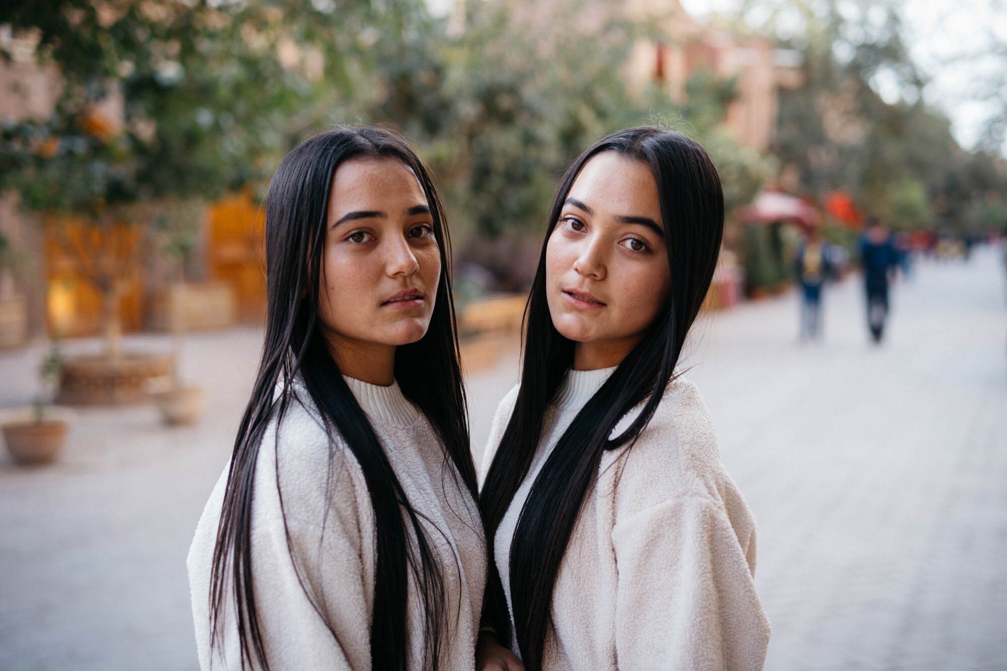  Two young women wearing identical clothes - are they twins? 