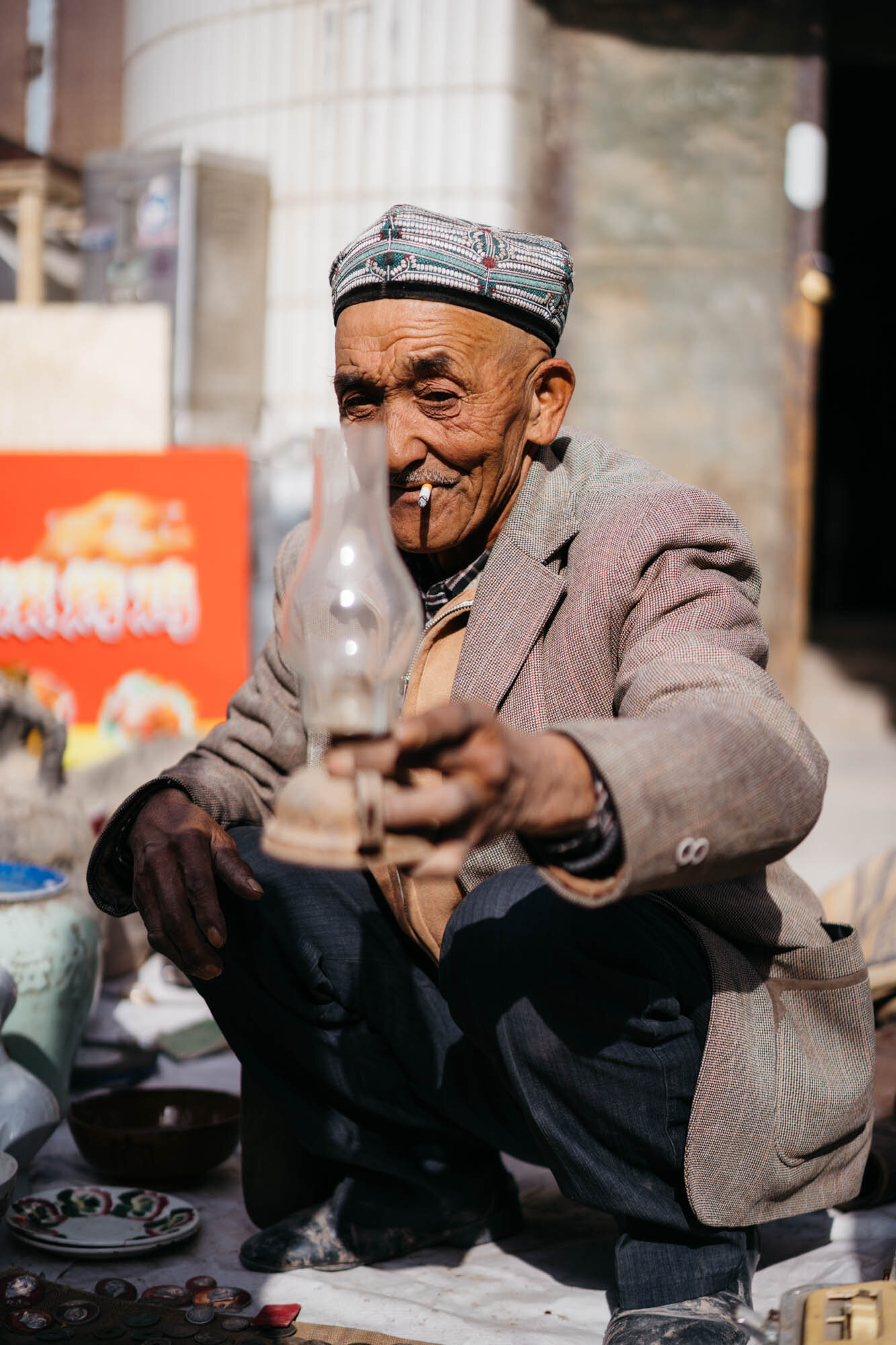  A Uyghur man selling wares at the bazaar 