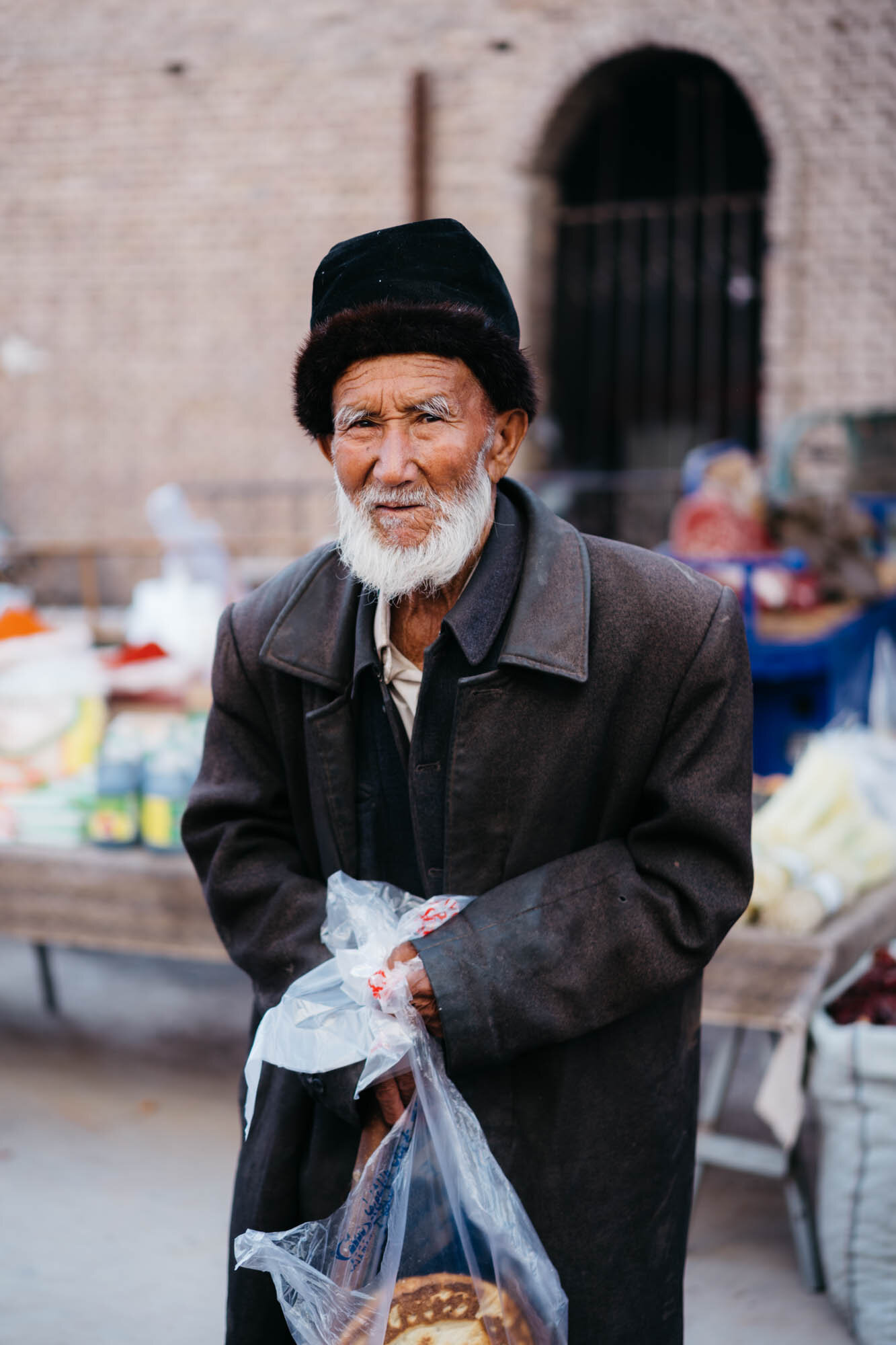  A Uyghur man in a traditional Kashgar hat at the bazaar 