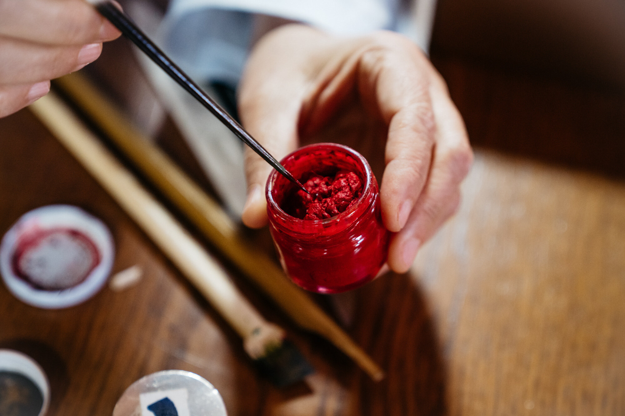  Ayten adds silk to her ink pots to keep them from drying   