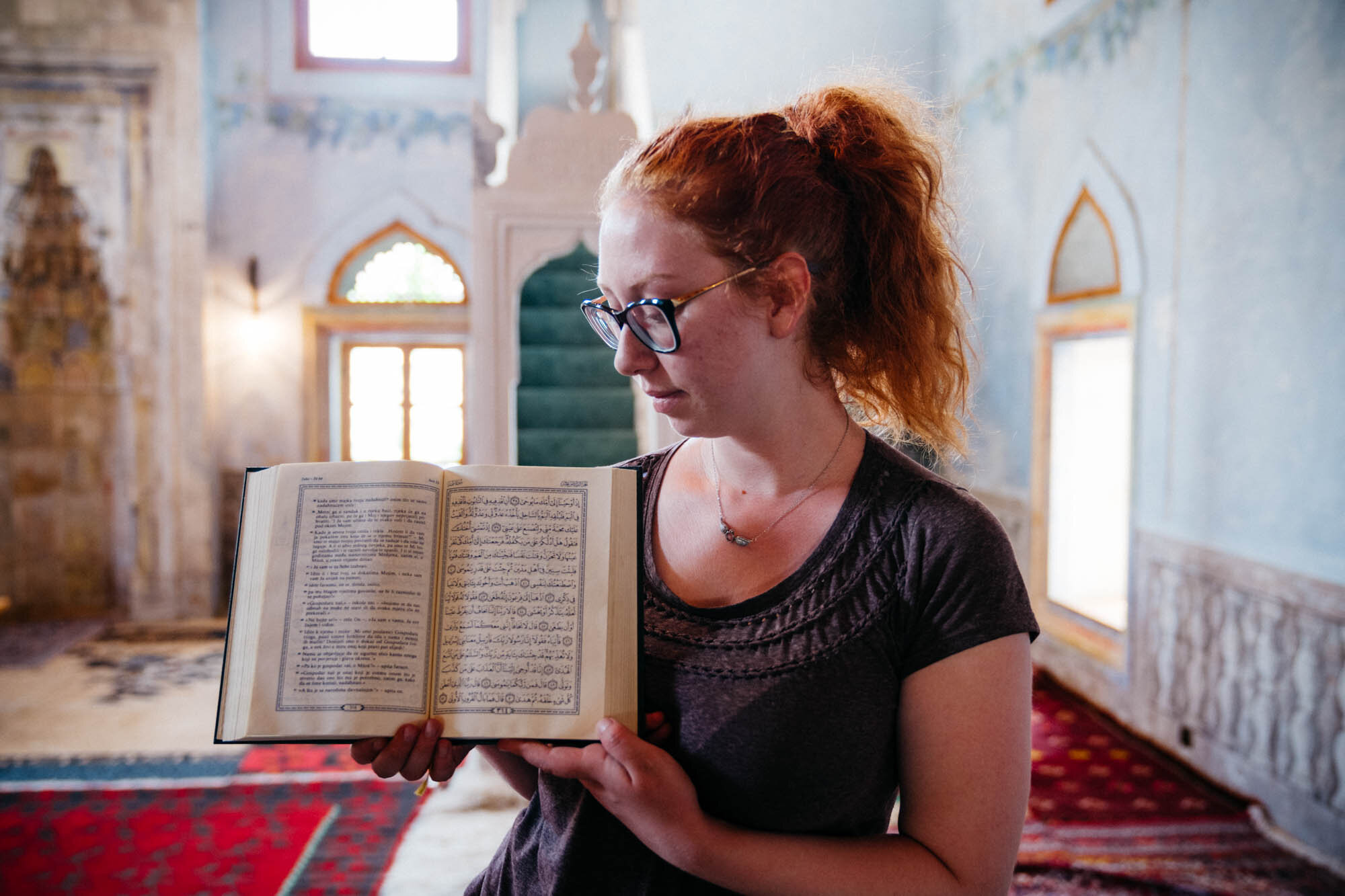  Ilma showing me a Quran in both Bosnian and Arabic language 