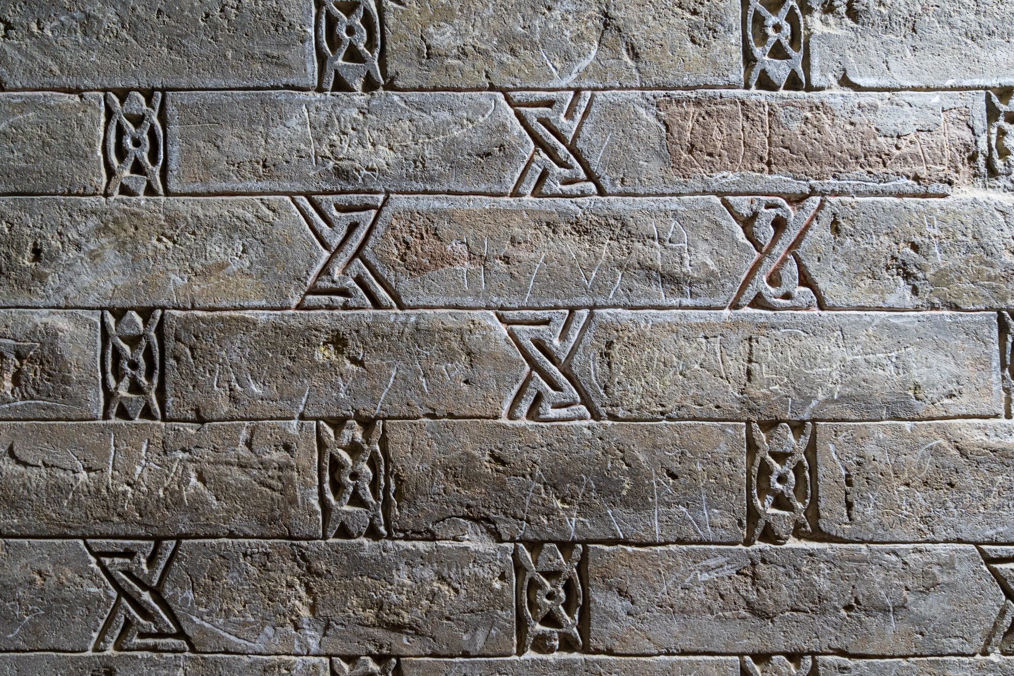  I believe these are Zoroastrian symbols, found on the interior brickwork 