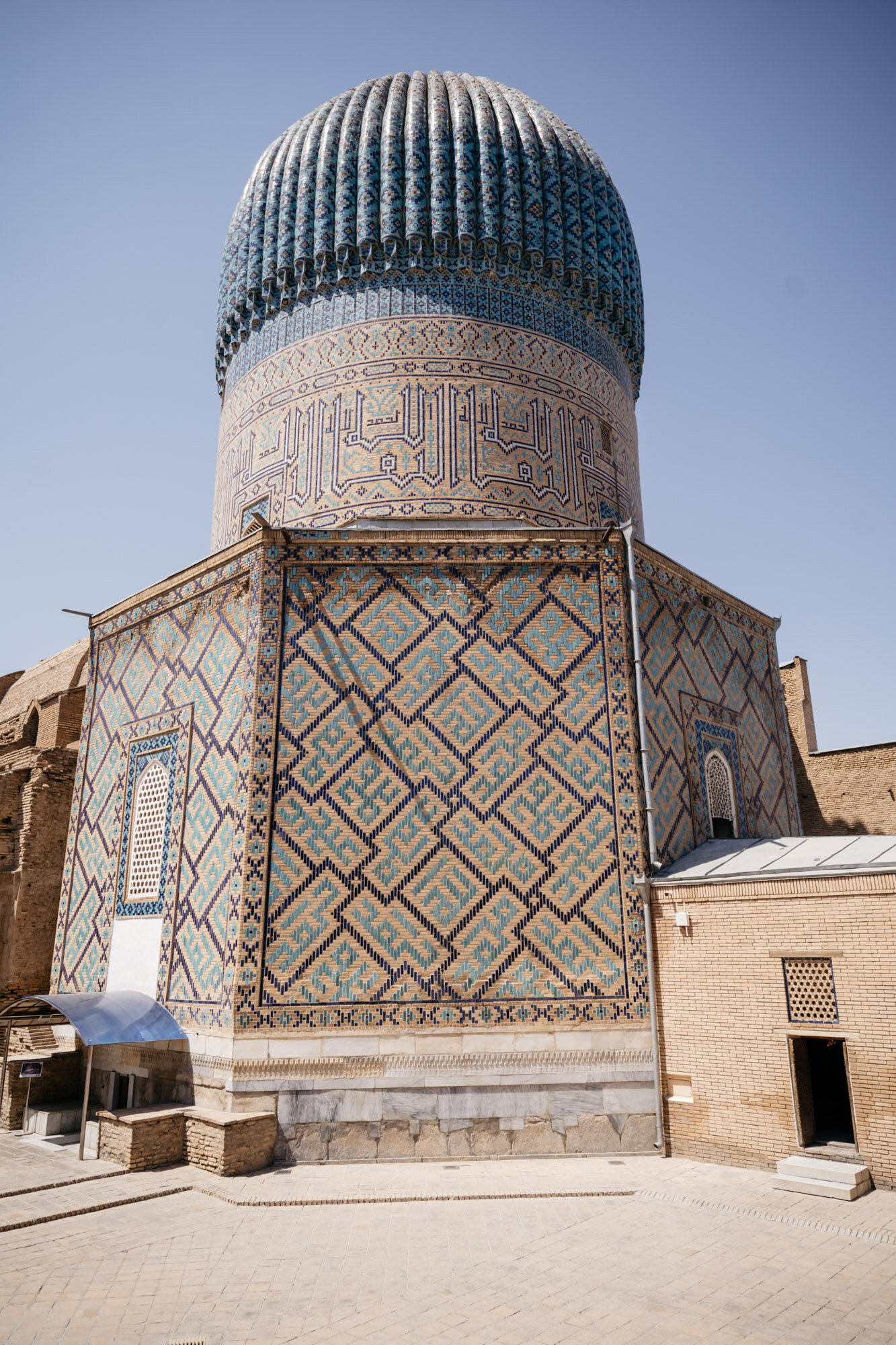  The building is covered in that immediately recognisable Timurid geometric tile work. The tiles spell out the numerous names of God. 