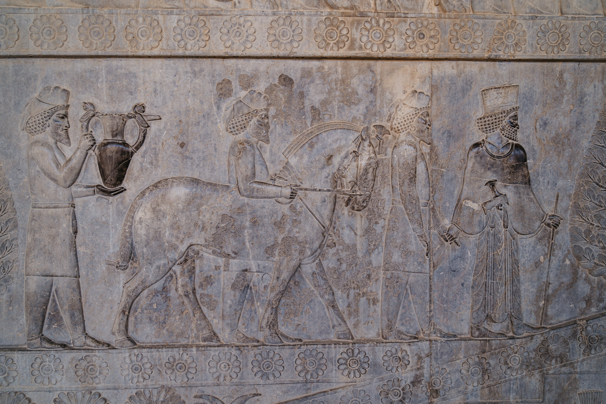  Bas reliefs that depict an Armenia delegations bringing tribute - a jar decorated with winged griffins - to the Achaemenid kings 