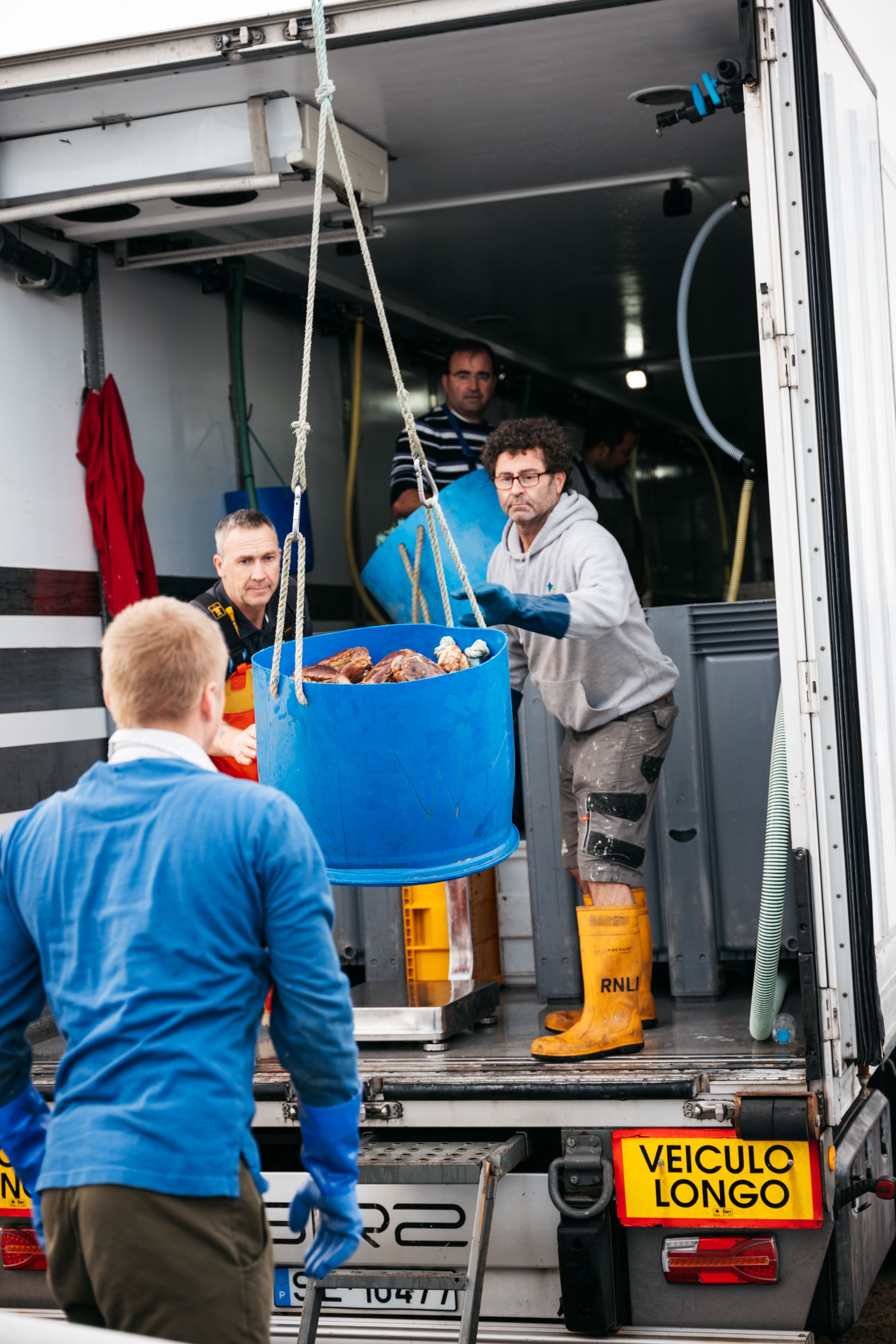  The buckets were then swung into the back of this lorry - final destination Portugal - and weighed. 