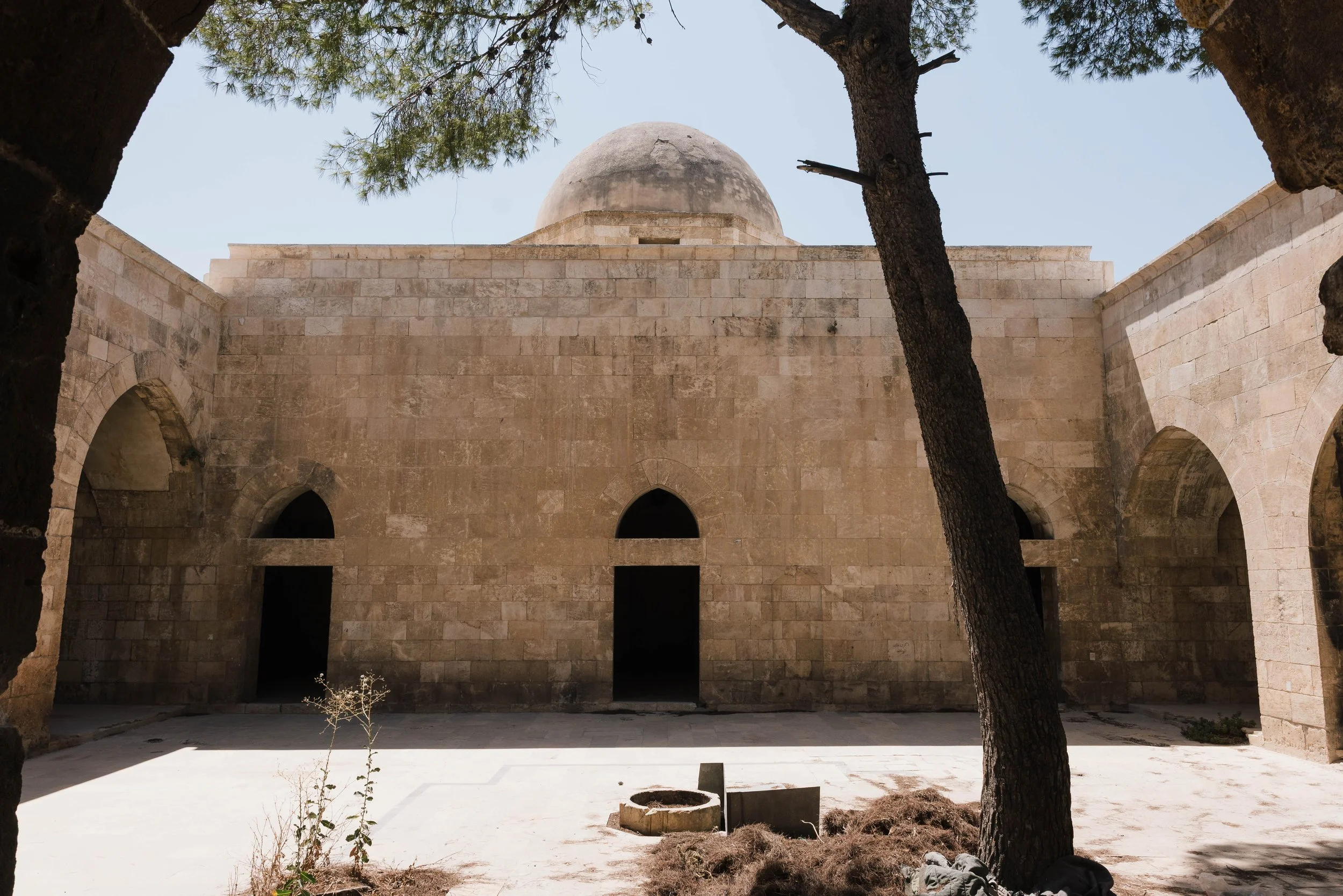  The interior courtyard of the Great Mosque of Aleppo's Citadel. This sparsely decorated mosque was constructed around 1213-14 CE during the Ayyubid period. 