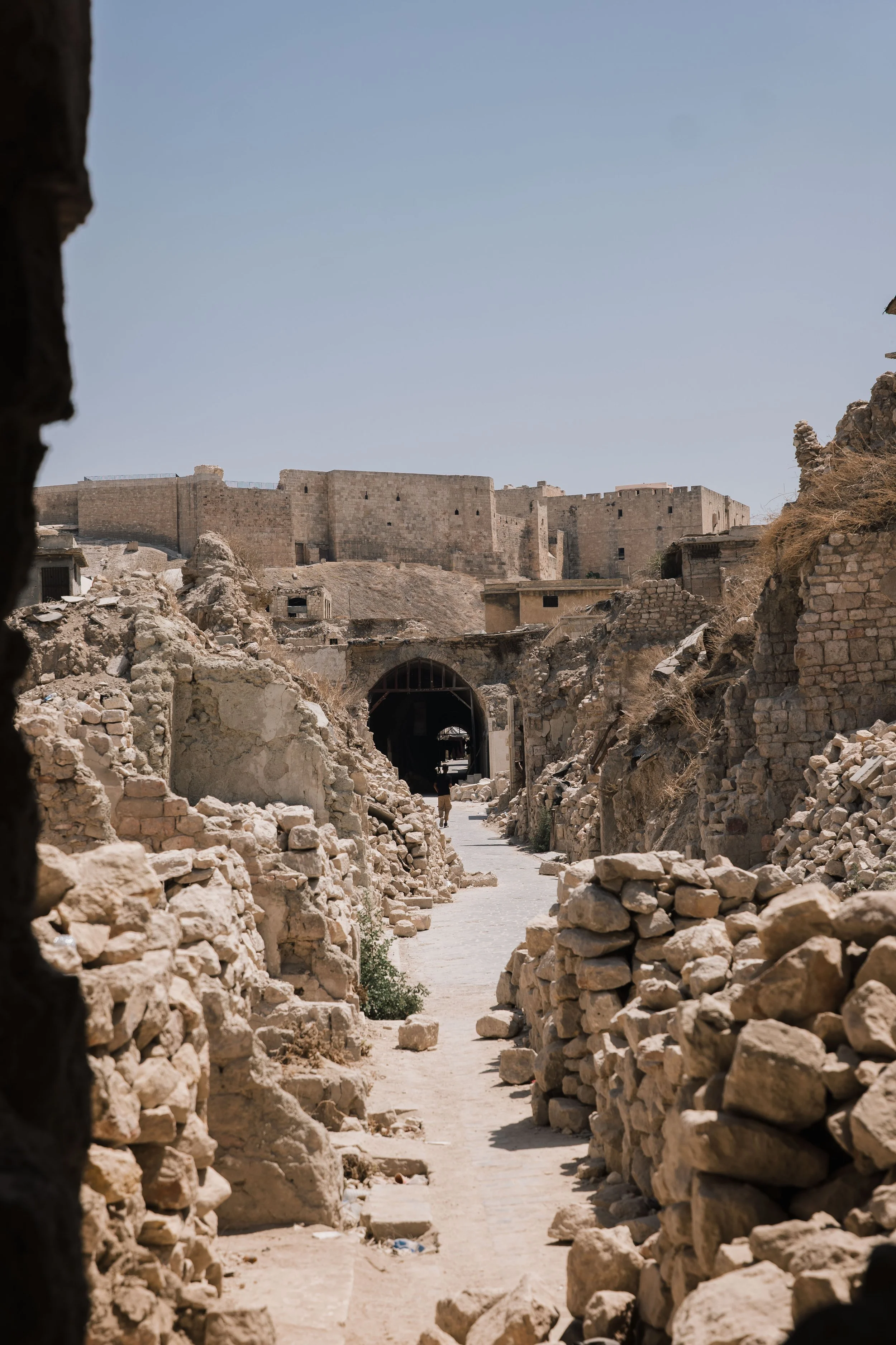  Destruction to the souk caused by war and the 2023 earthquake. The Citadel can be seen in the background 