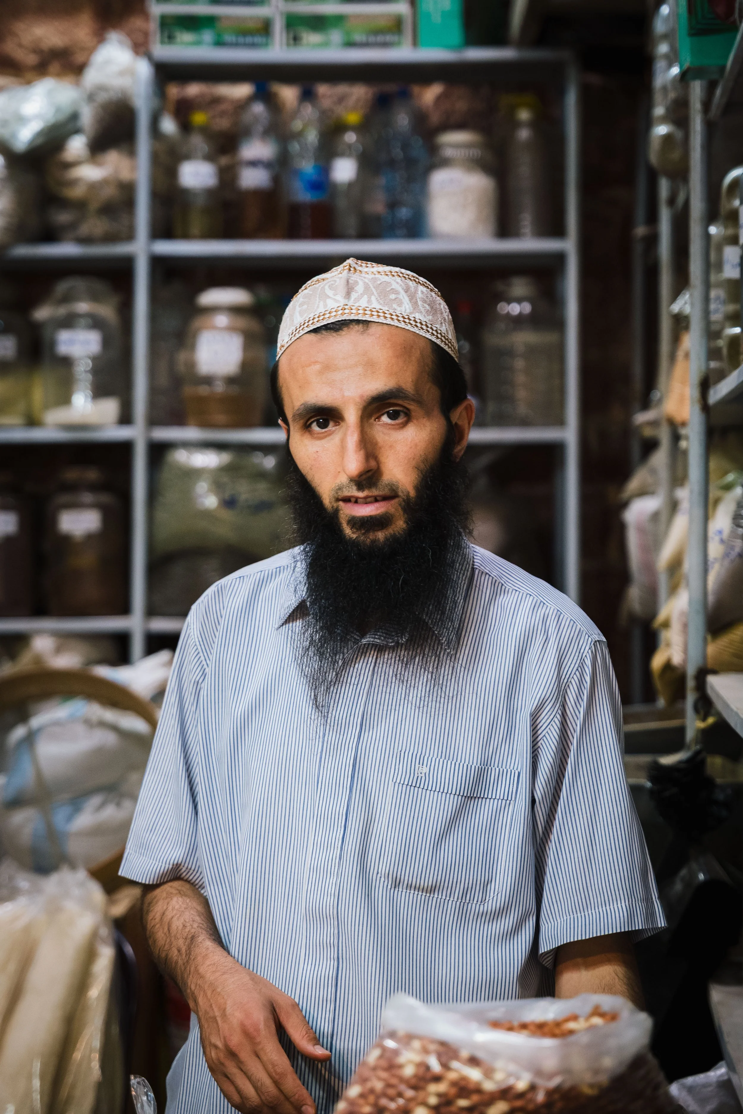  A shopkeeper selling a variety of spices 