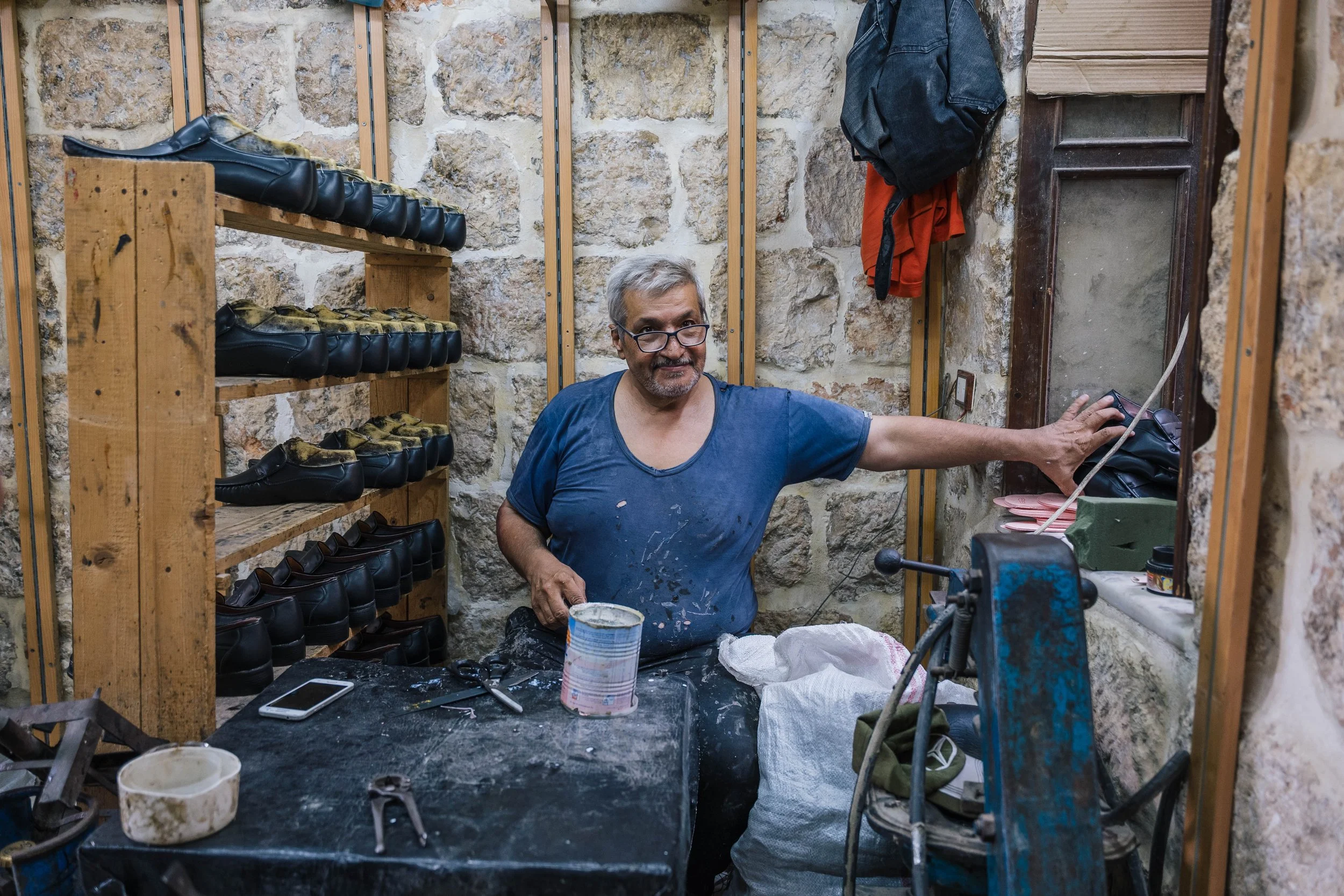  A shoe maker in his workshop 