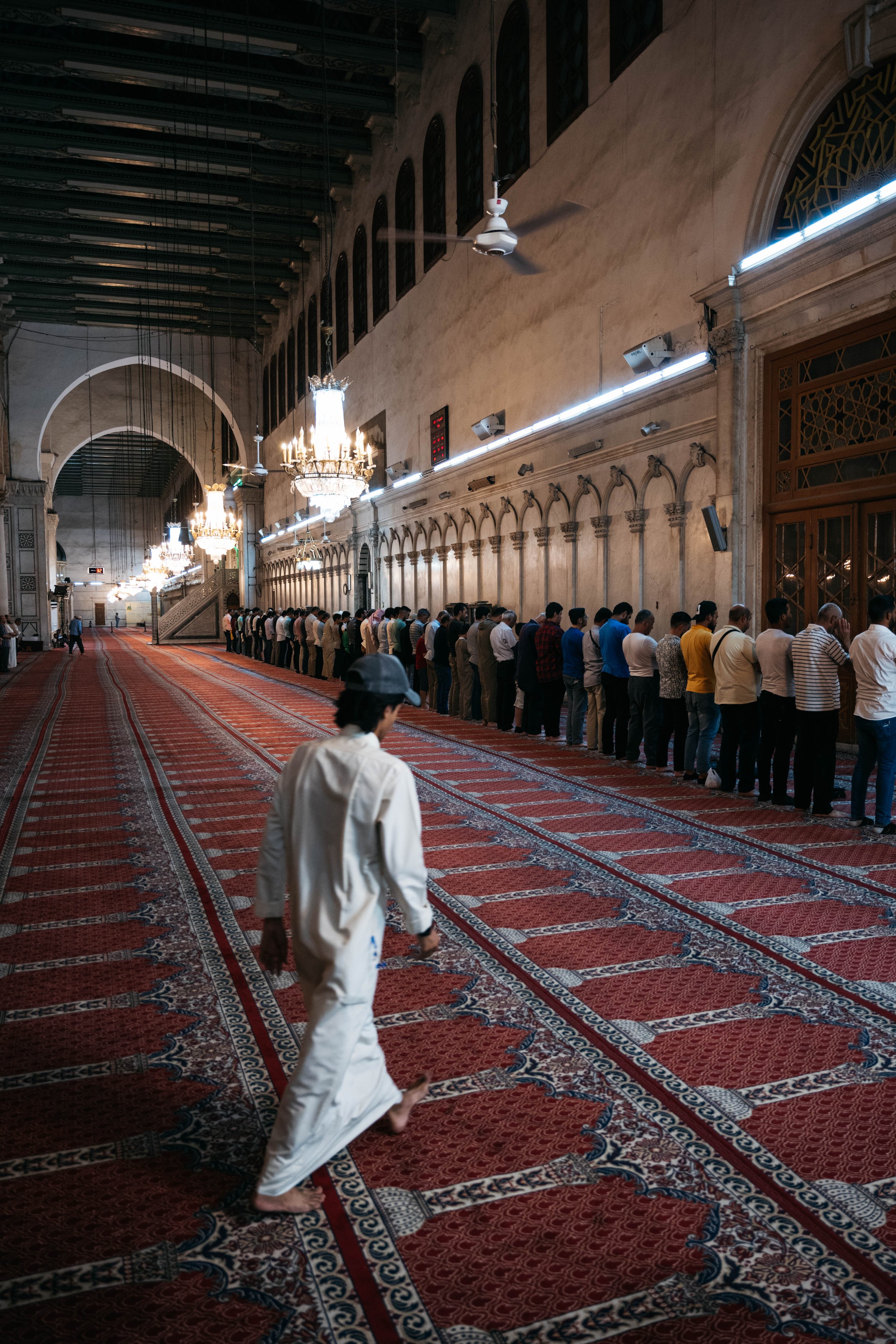 A latecomer on his way to prayer. 