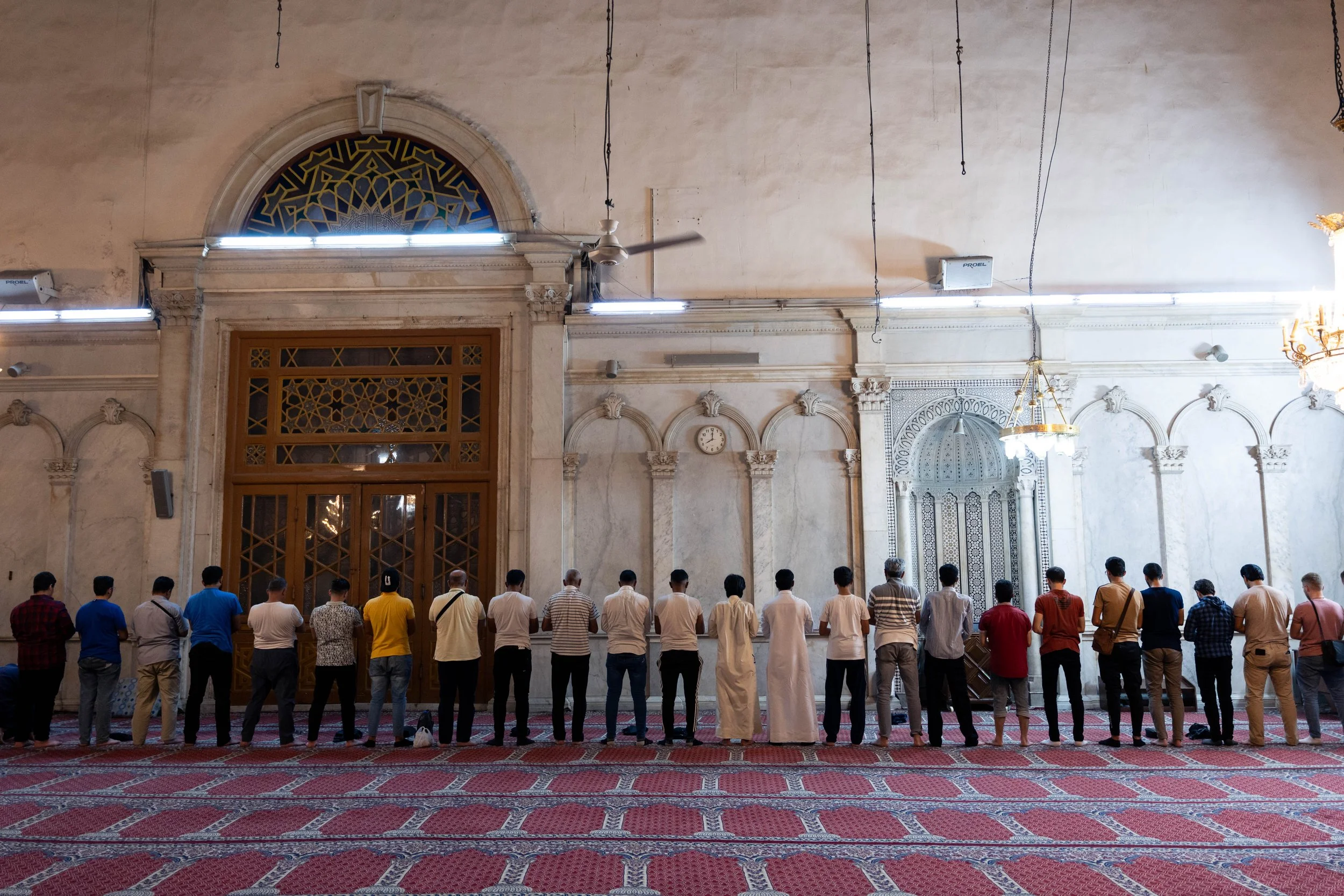 Men stand to pray 