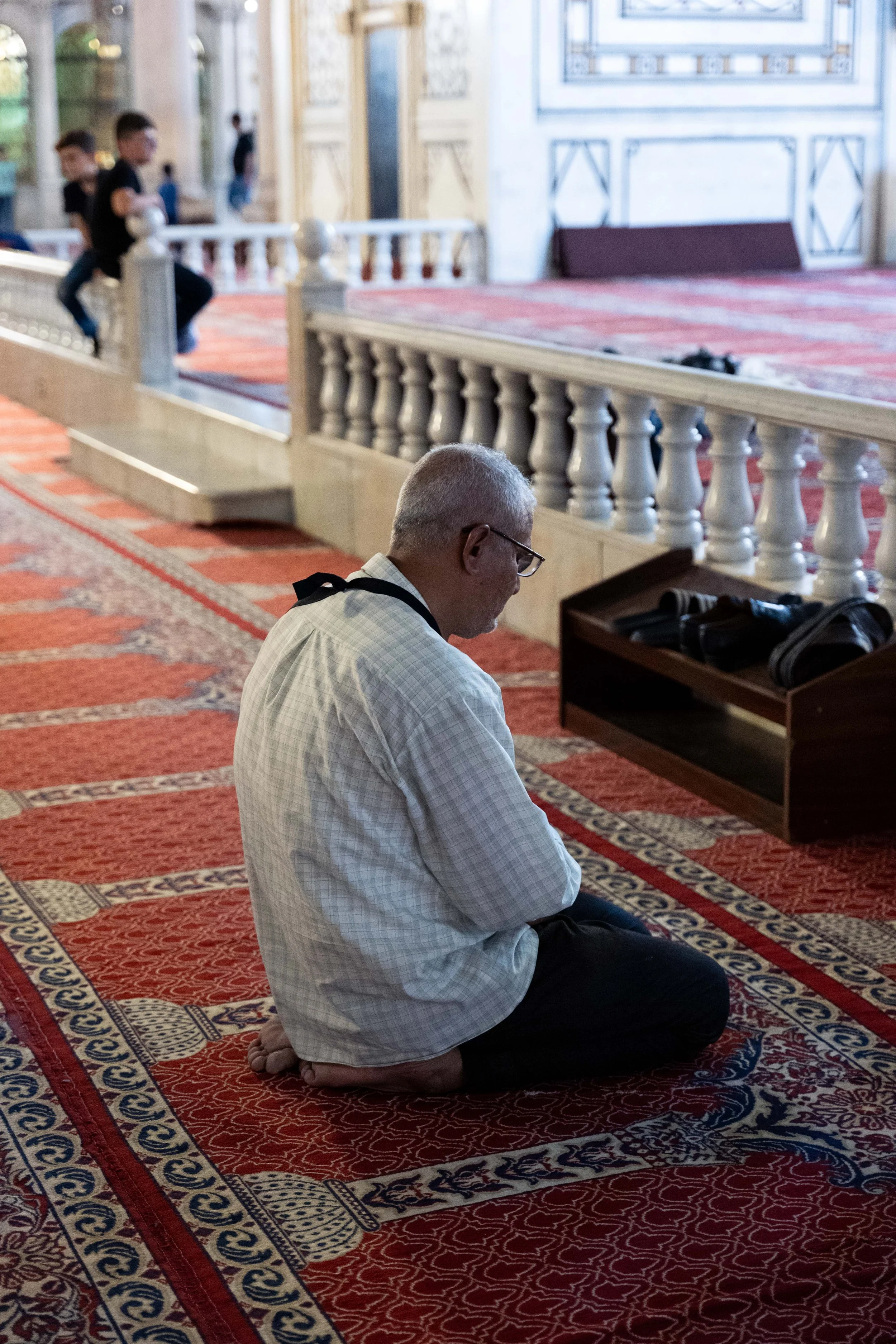  A man kneels in prayer and quiet contemplation. 