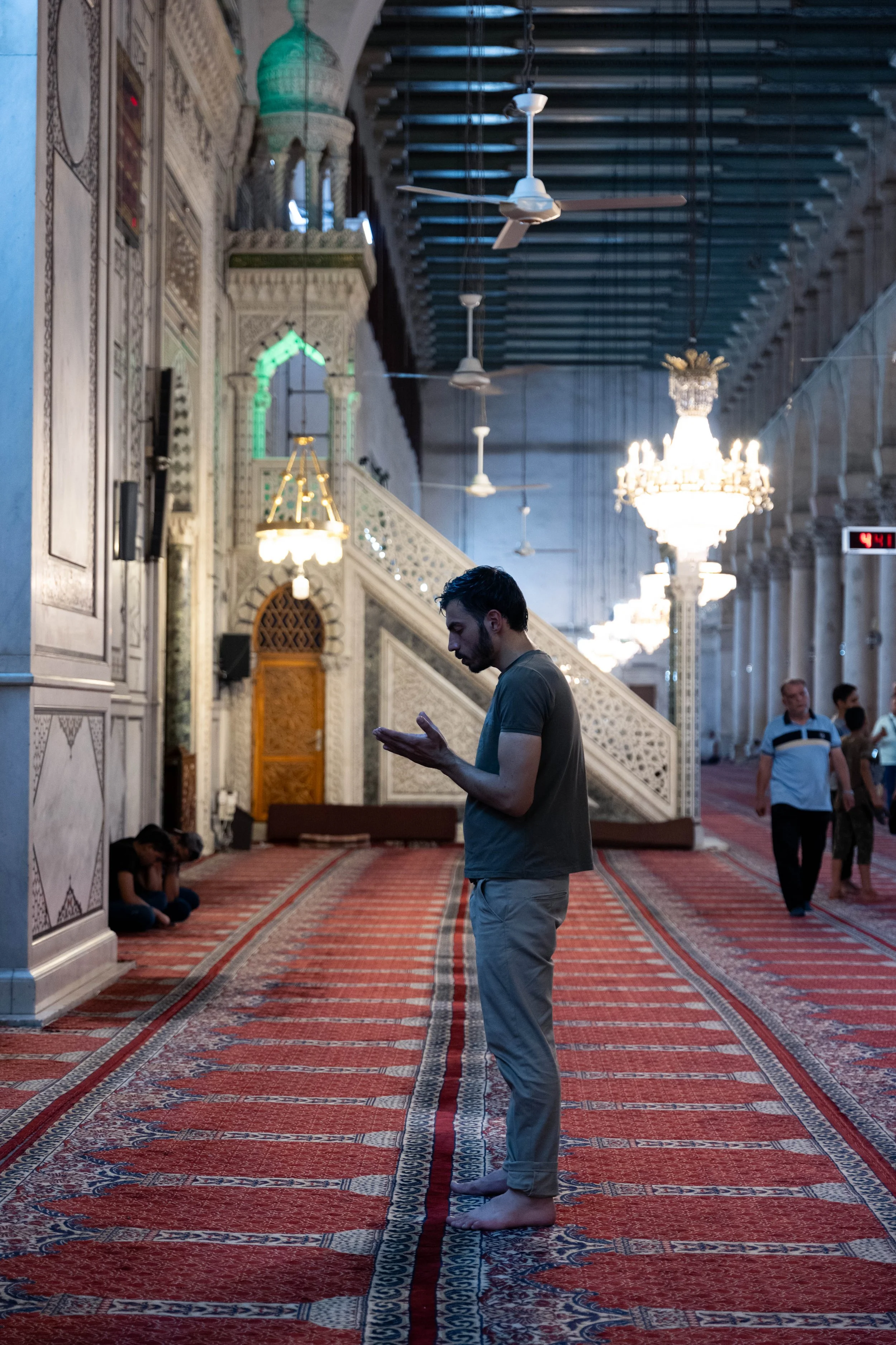  A man prays in front of the  qibla  wall. 