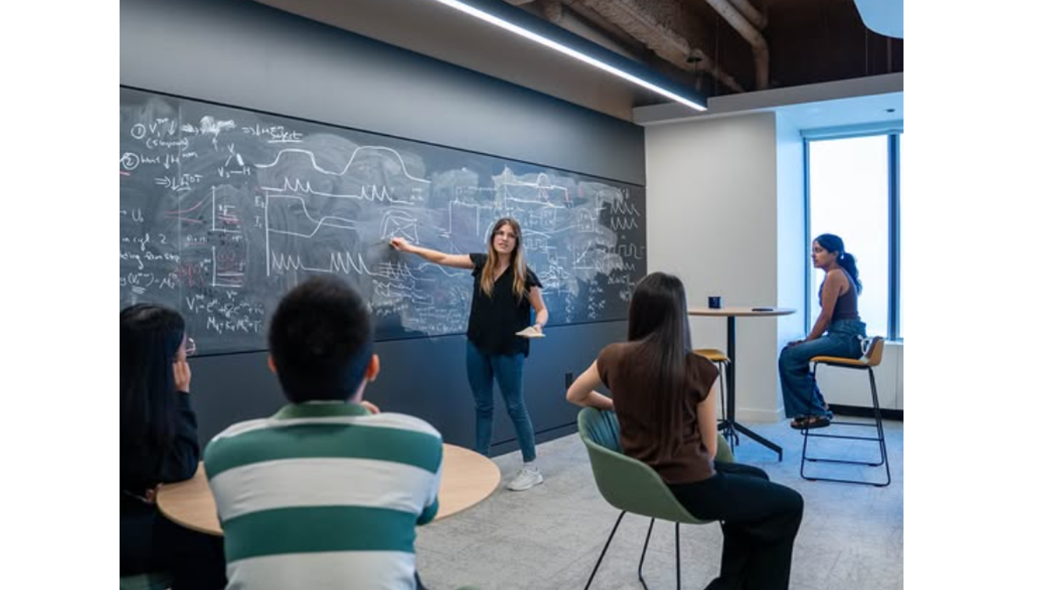 2025 Summer Undergraduate Research Program participants engaged in a science communication workshop with Heather Barnes of Improv @ Work.