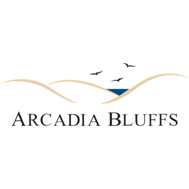 Illustration of hills, water, and flying birds with the text 'Arcadia Bluffs' at the bottom.