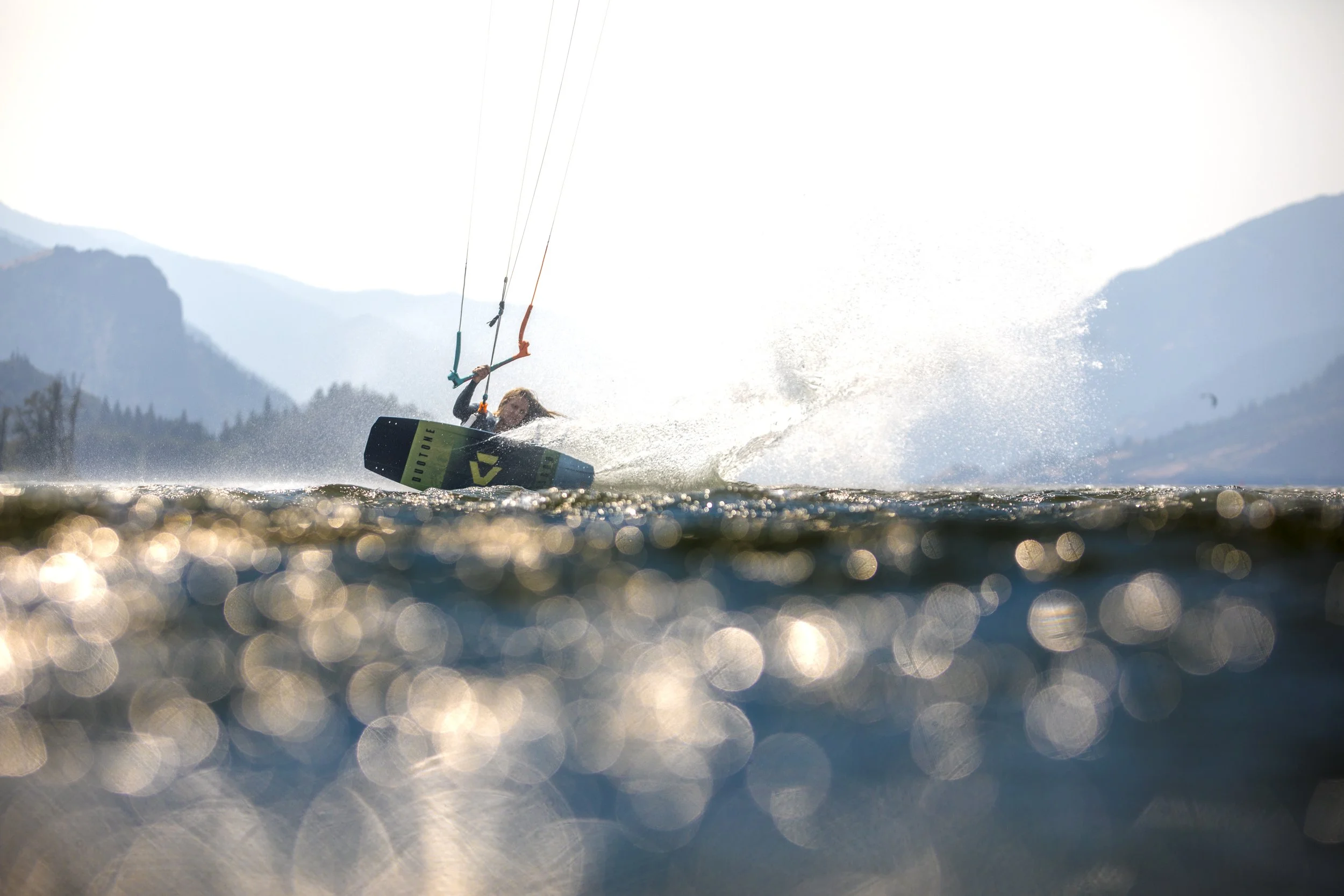Kite surfer gliding along the Columbia River. Photo by Toby Bromwich.