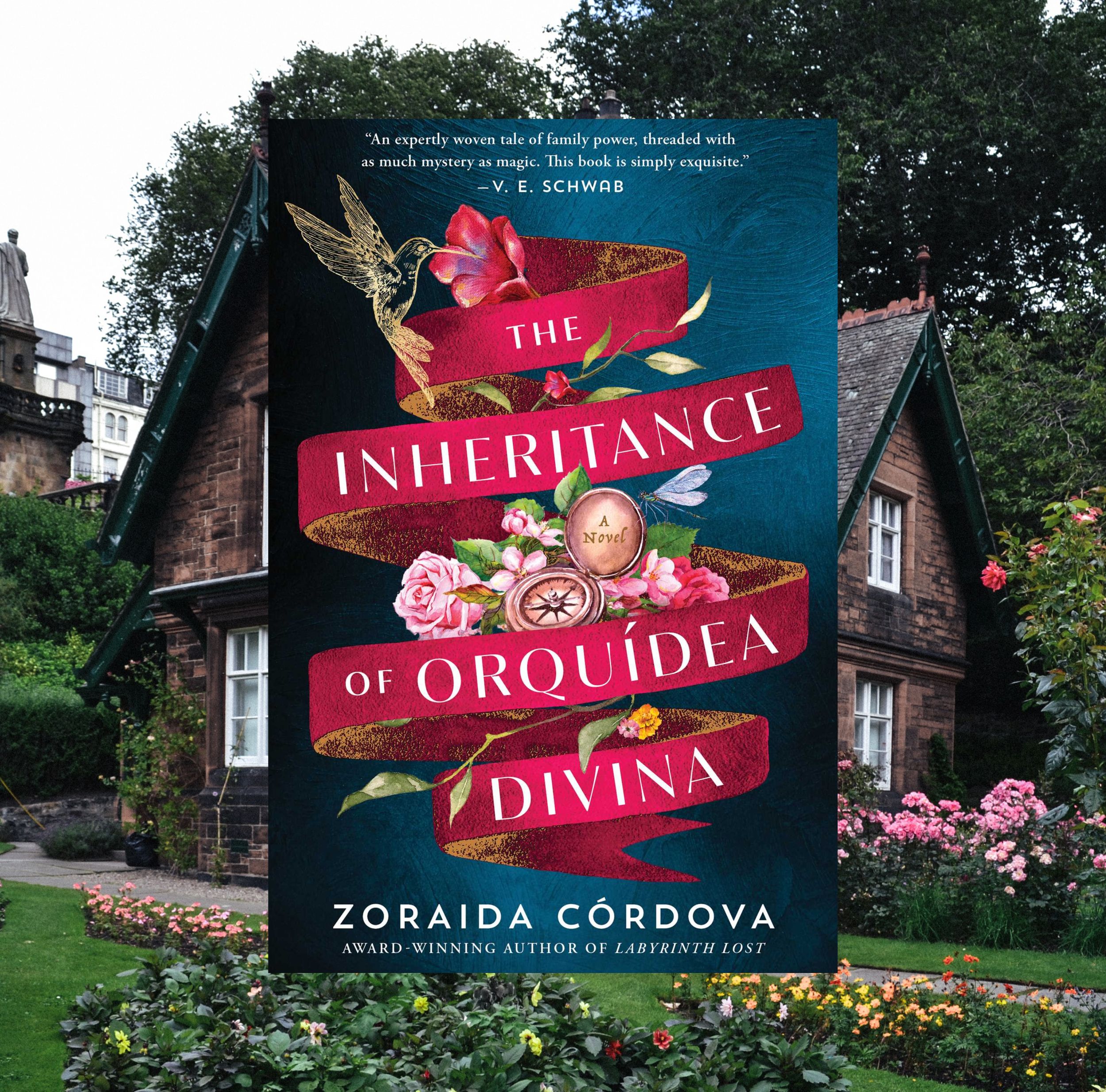 The cover of The Inheritance of Orquídea Divina by Zoraida Córdova on a background of a photo of a brick building with a garden.