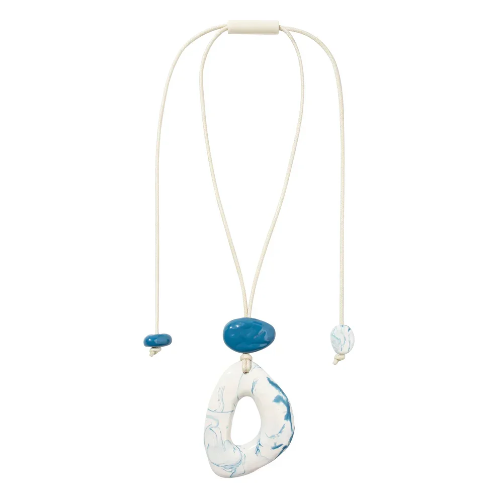 Blue and white resin necklace by Zsiska.