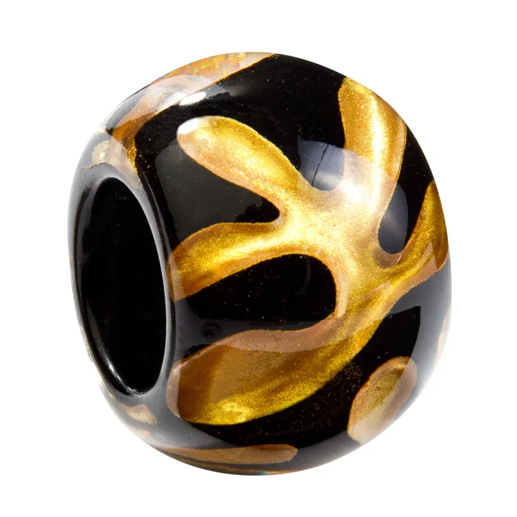 BGMT1.  Black and gold resin bead by Zsiska