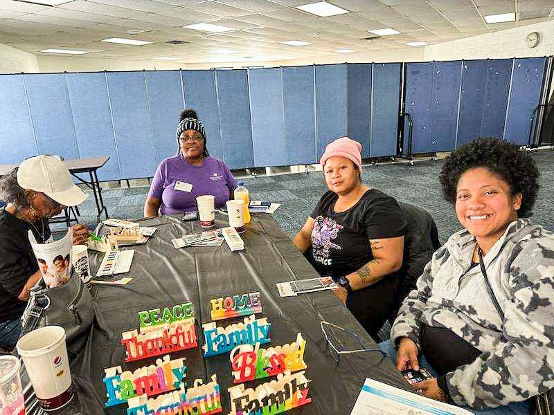 Family Focus Englewood Parent Mentors at Fort Dearborn Elementary School draw and brainstorm their dream school and discuss what resources Family Focus has to offer.