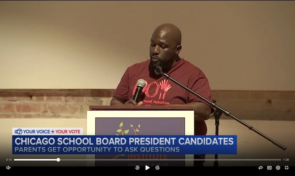 Black father holds microphone asking presidential candidates a question