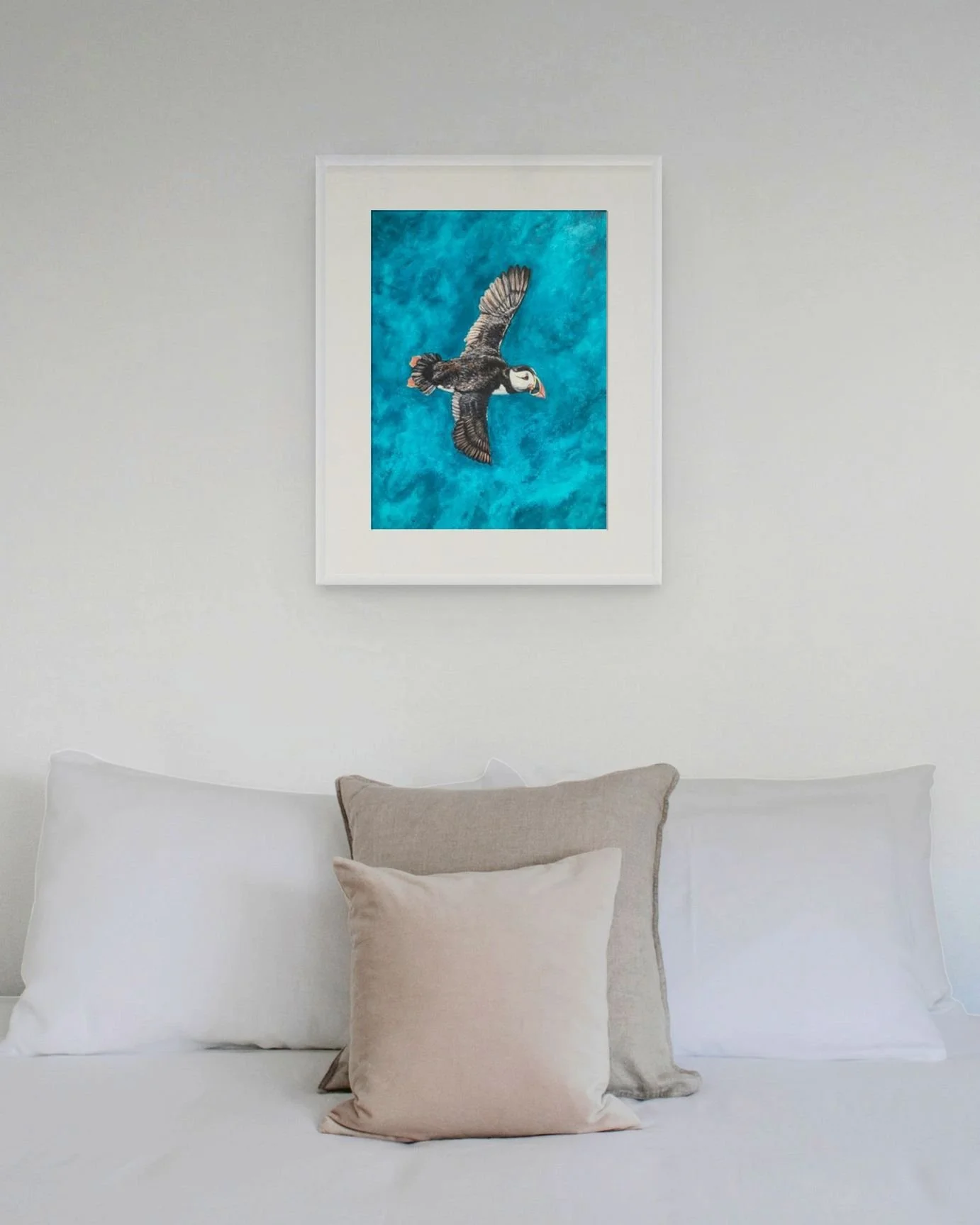 Puffin by Joy Clifton is an original acrylic puffin painting, capturing British coastal wildlife from a unique aerial perspective. Framed seabird art.
