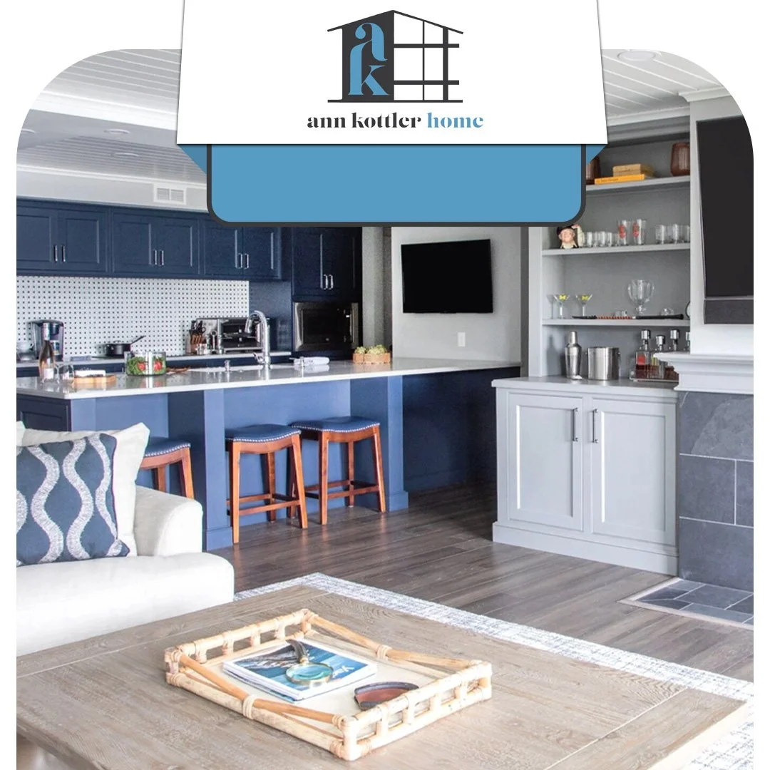 Modern kitchen with blue cabinetry, a spacious island, and open-concept living space.