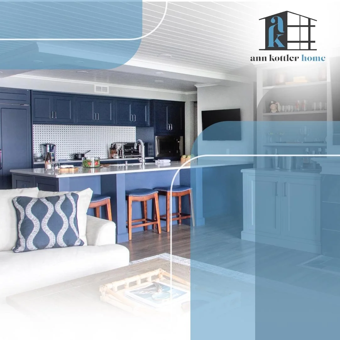 Open-concept living room and kitchen featuring custom cabinetry, spacious island seating, and coordinated interior design elements.