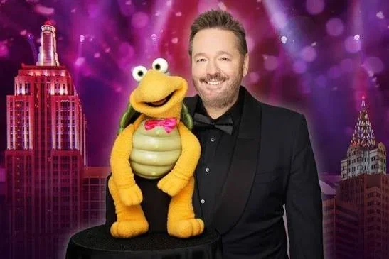 A photo of ventriloquist Terry Fator with Winston the impersonating turtle a turtle