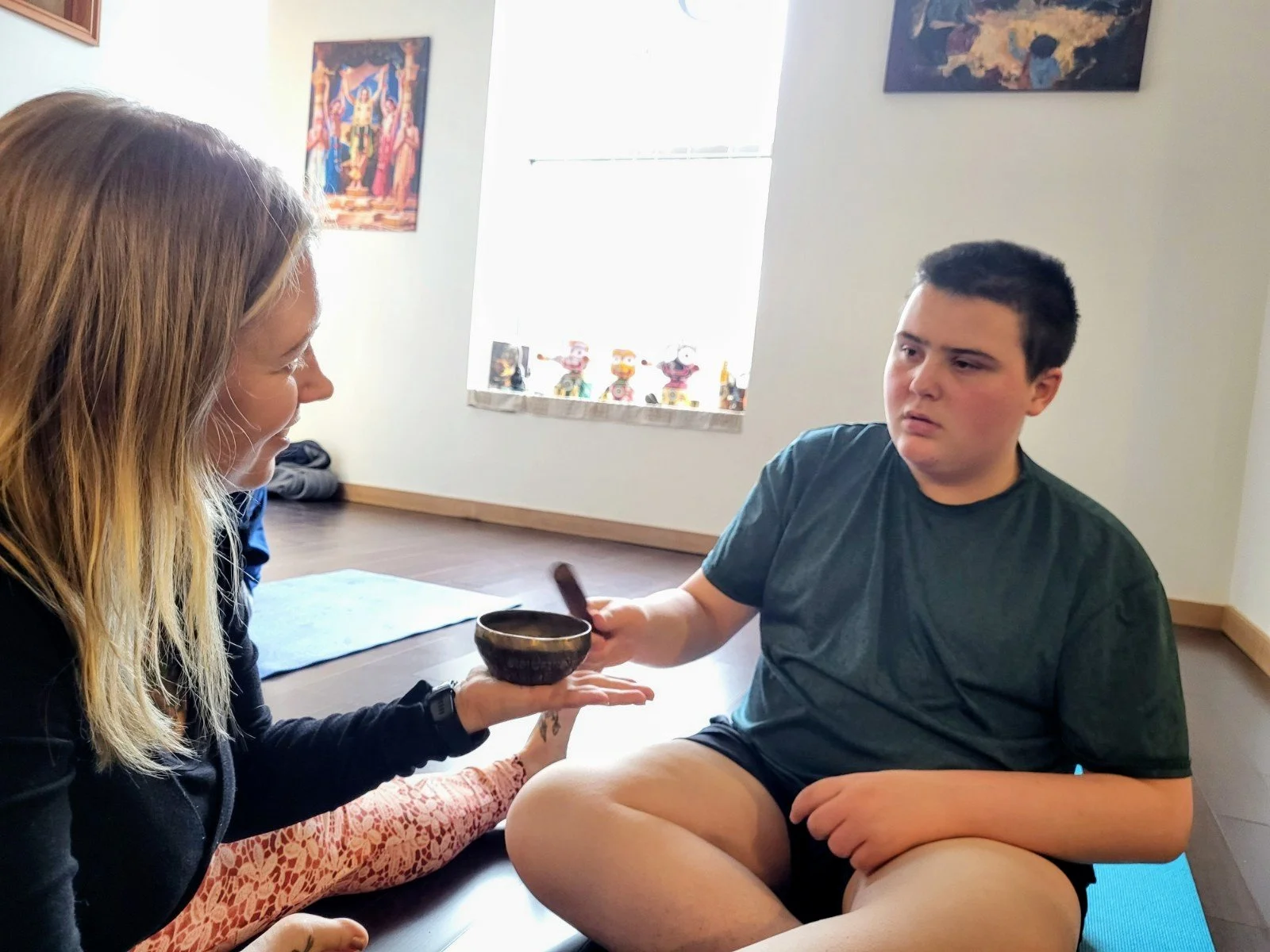 Lauren Reek adaptive yoga teacher working with teen with autism Long Island
