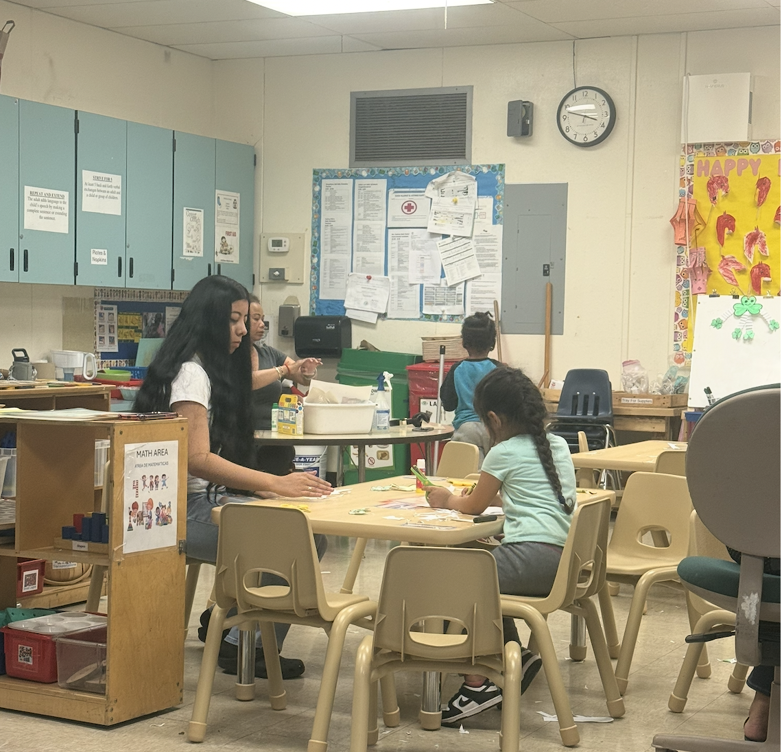 Teachers in a Pk-3 classroom