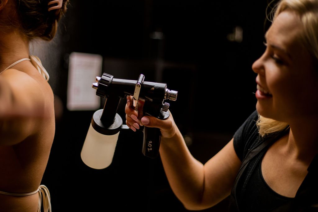 skilled spray tan technician