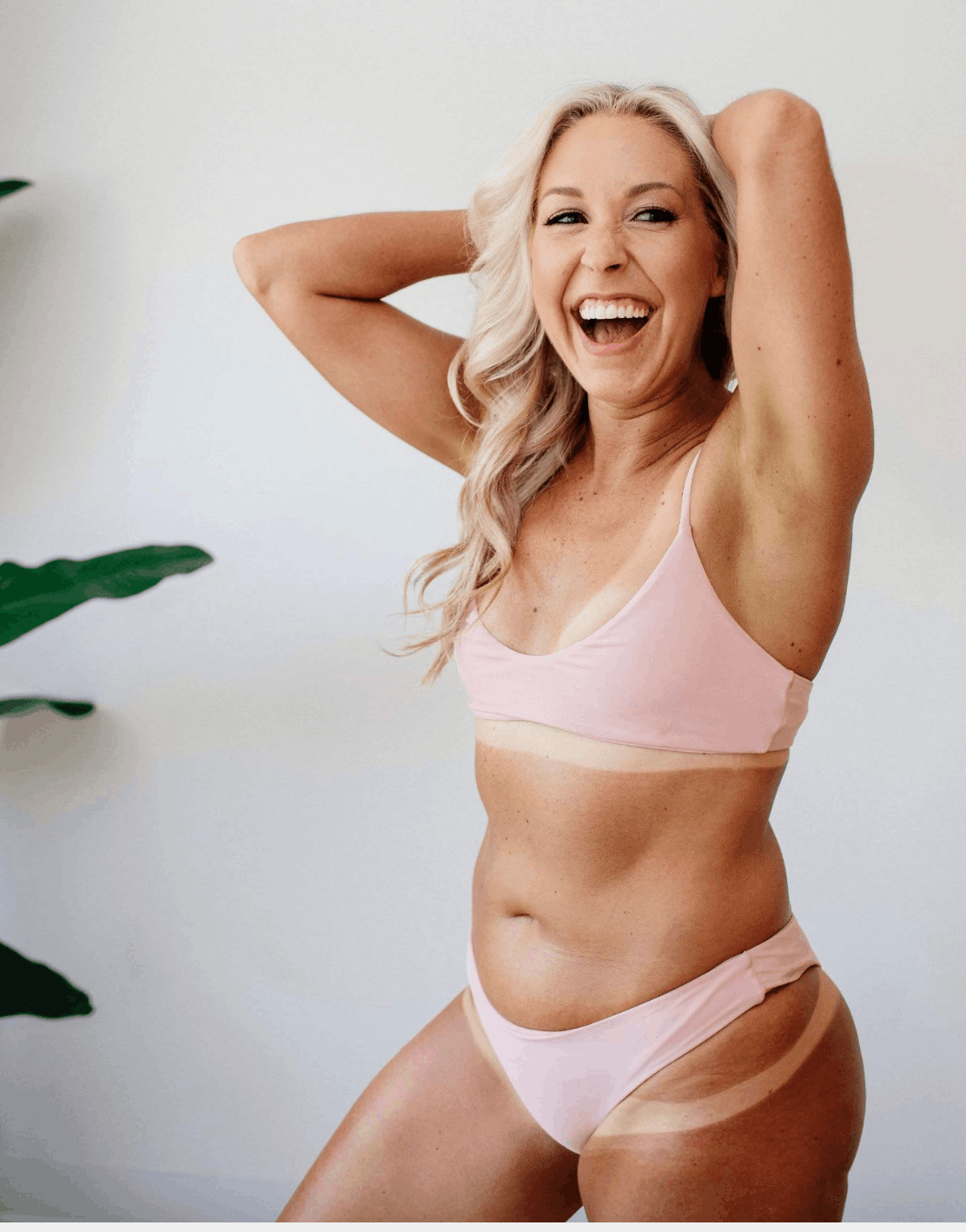 mature woman happy with airbrush spray tan