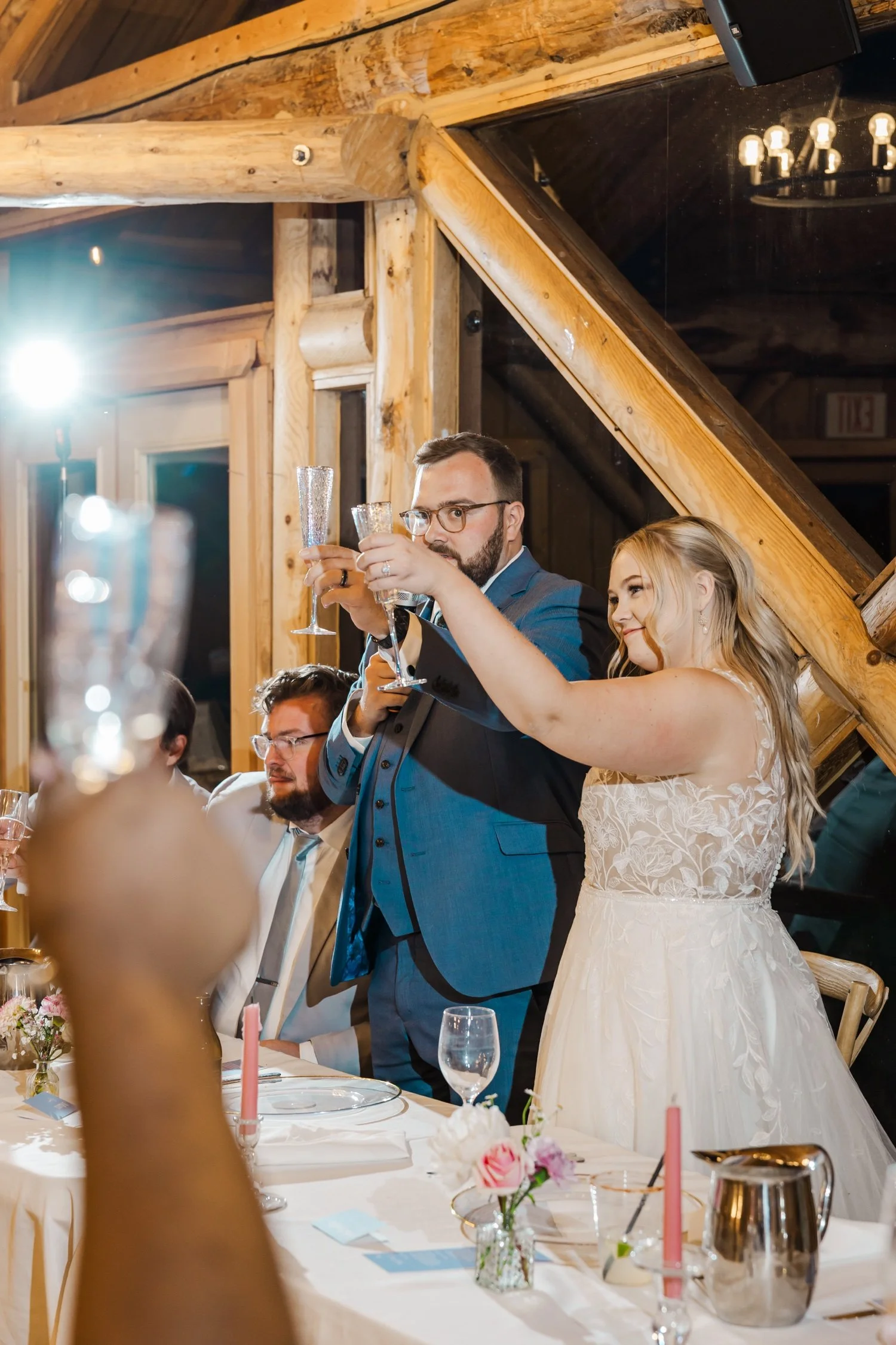 48_bride-and-groom-toast-colorado-cabin-style-wedding-venue.jpg