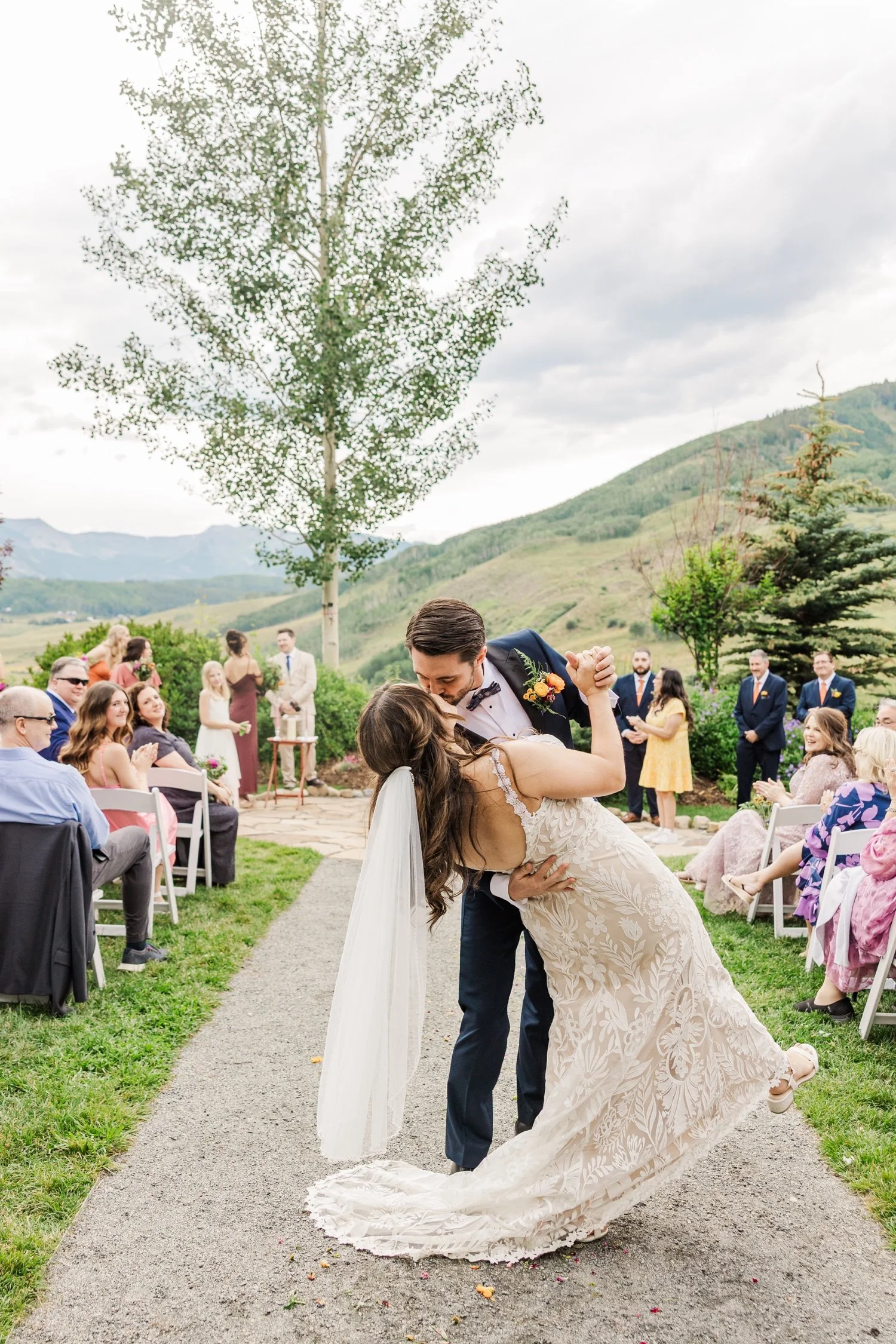 20_bride-and-groom-kiss-after-outdoor-ceremony-at-crested-butte-wedding-venue.jpg