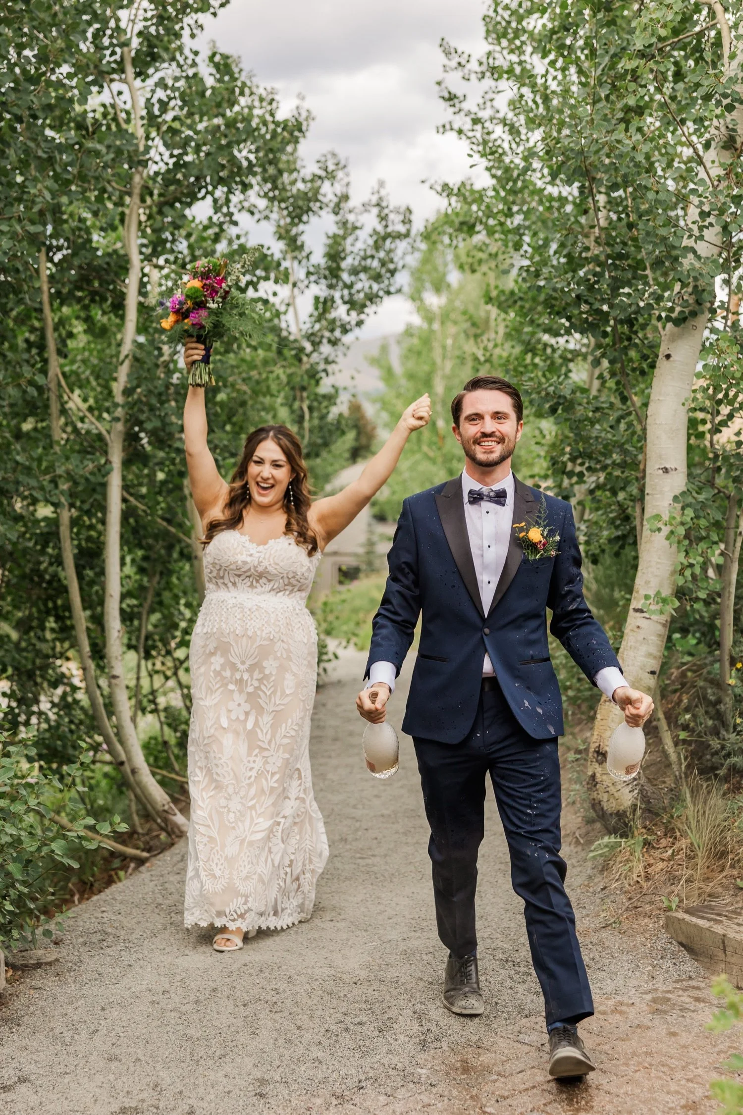 33_bride-and-groom-entrance-outdoor-colorado-wedding-champagne-pop.jpg