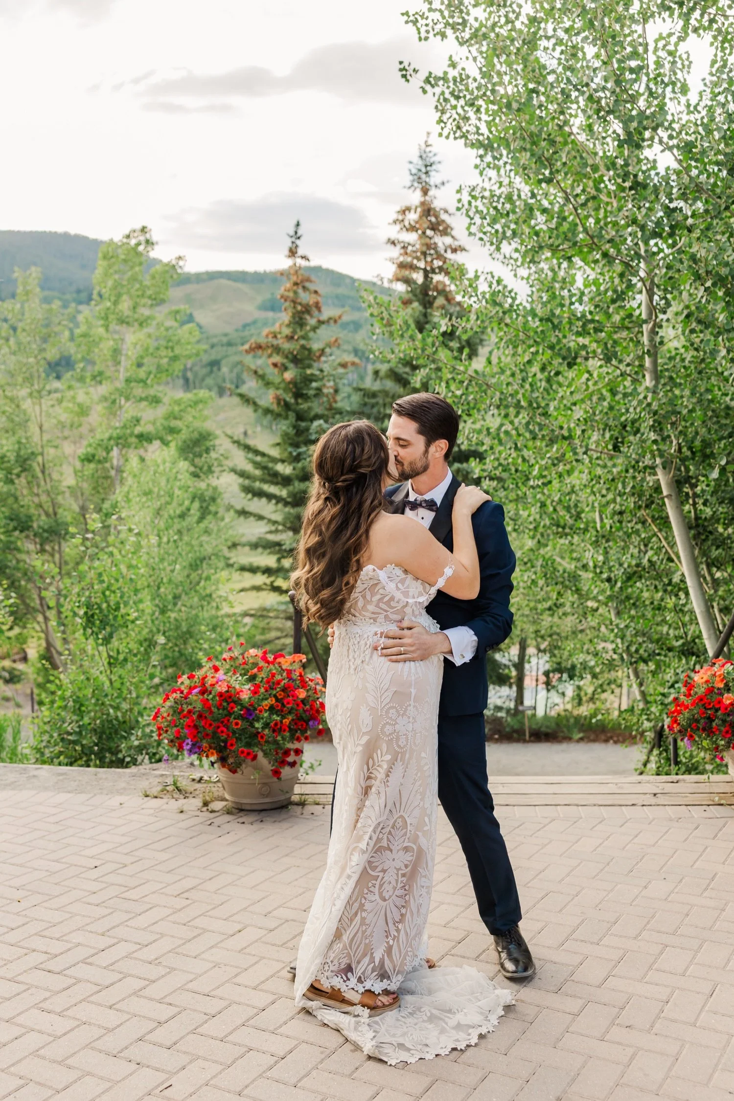 40_bride-and-groom-first-dance-on-outdoor-patio-at-colorado-wedding-venue.jpg