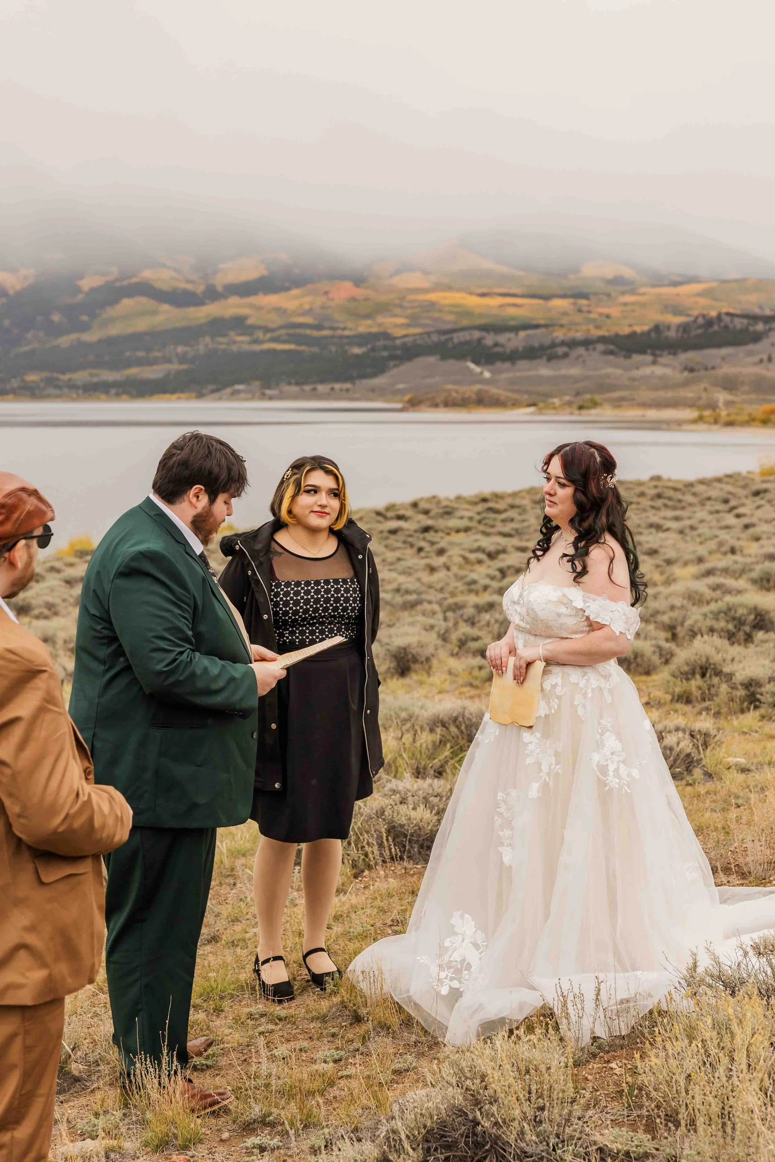 4-bride-and-groom-share-intimate-moment-overlooking-twin-lakes-colorado.jpg