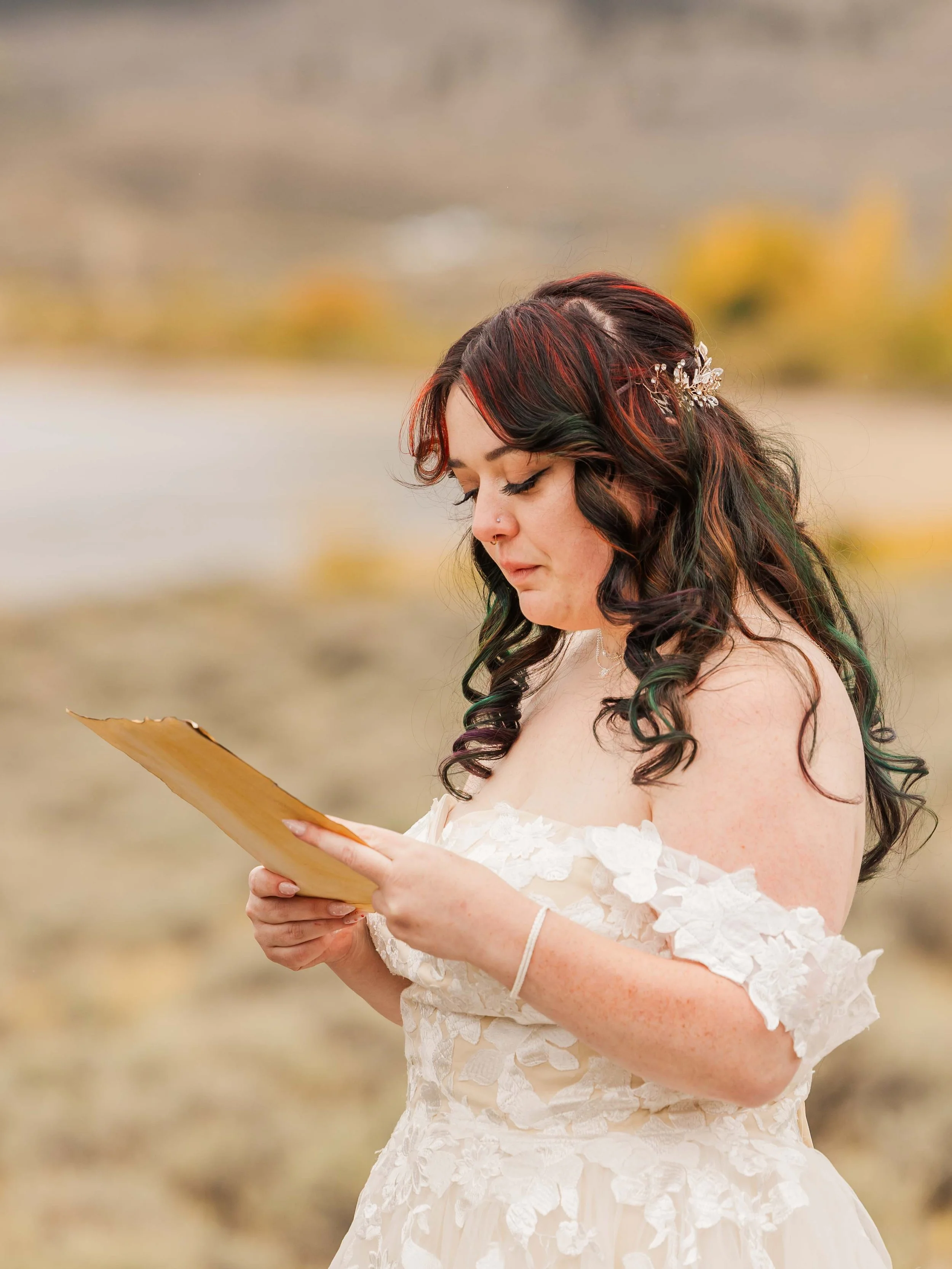 7-bride-with-colorful-hair-and-lace-dress-says-vows-during-colorado-elopement-ceremony.jpg