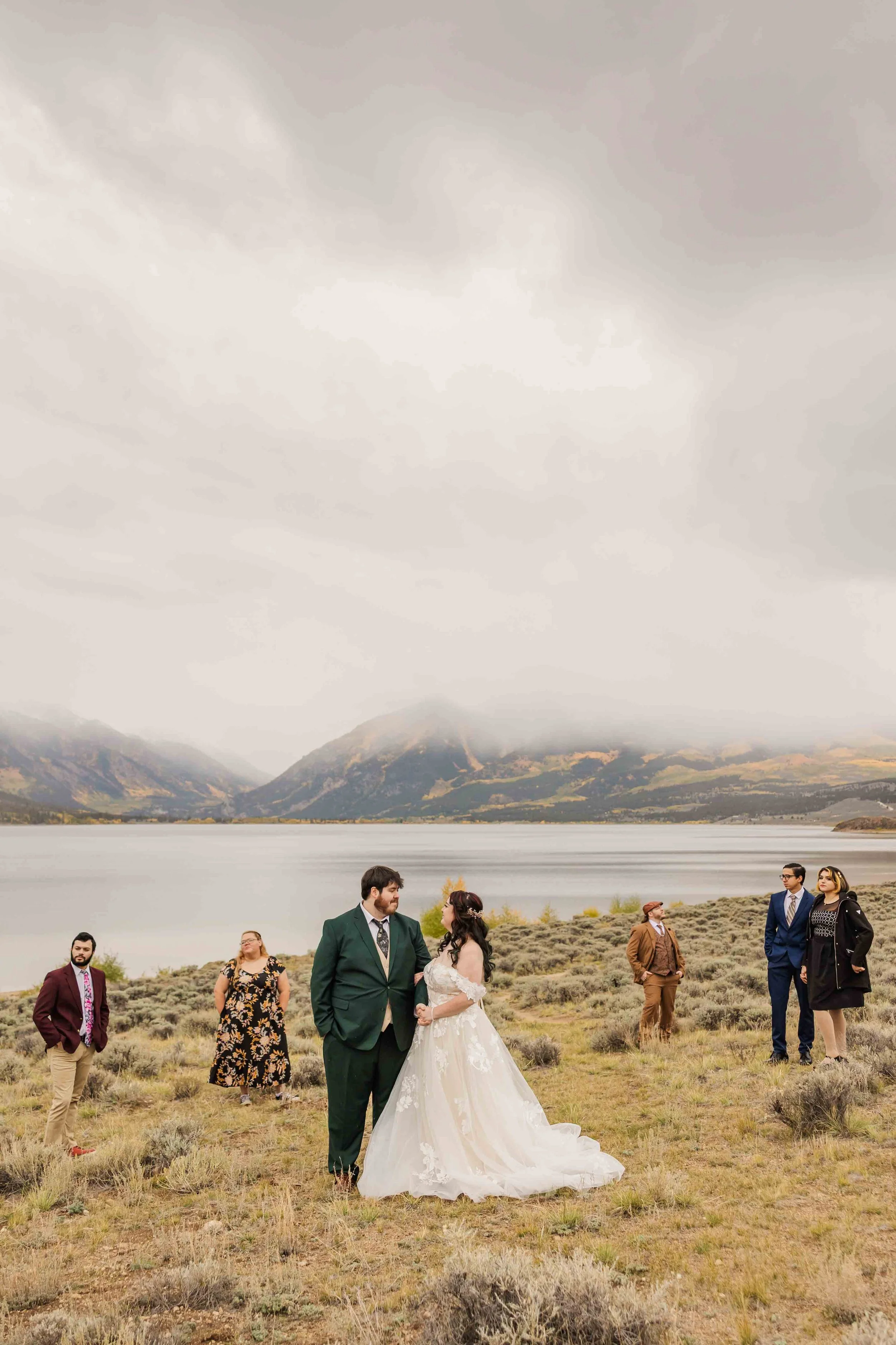 15-bride-and-groom-pose-with-friends-following-elopement-ceremony-colorado.jpg
