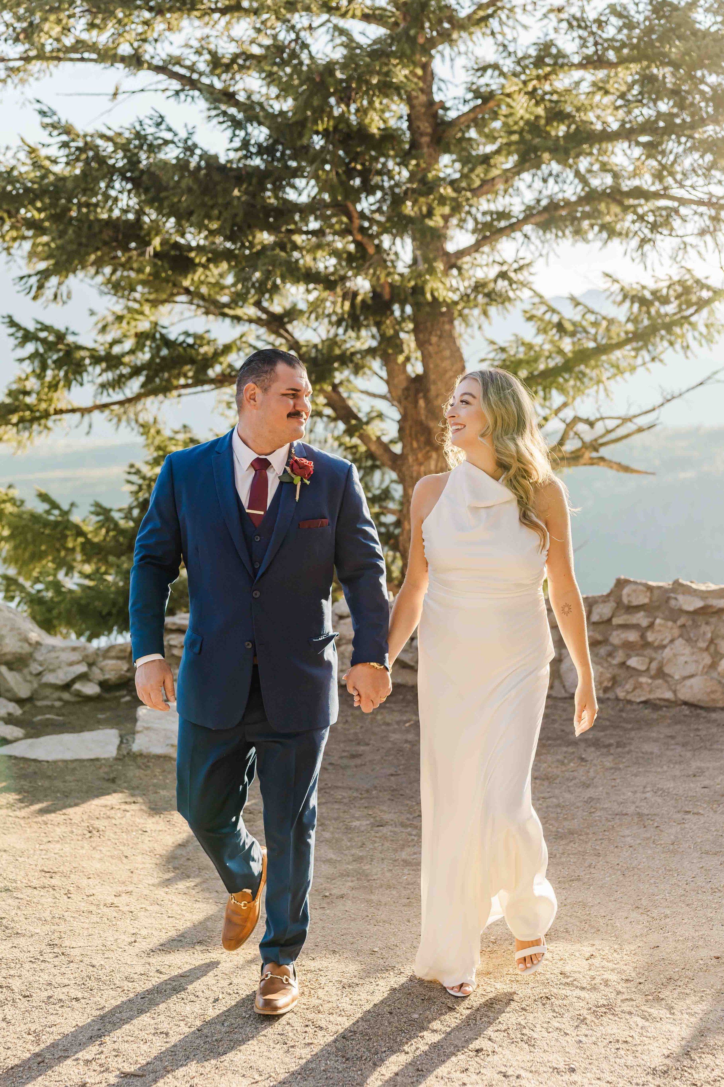 26_bride-and-groom-walking-at-sapphire-point-overlook.jpg