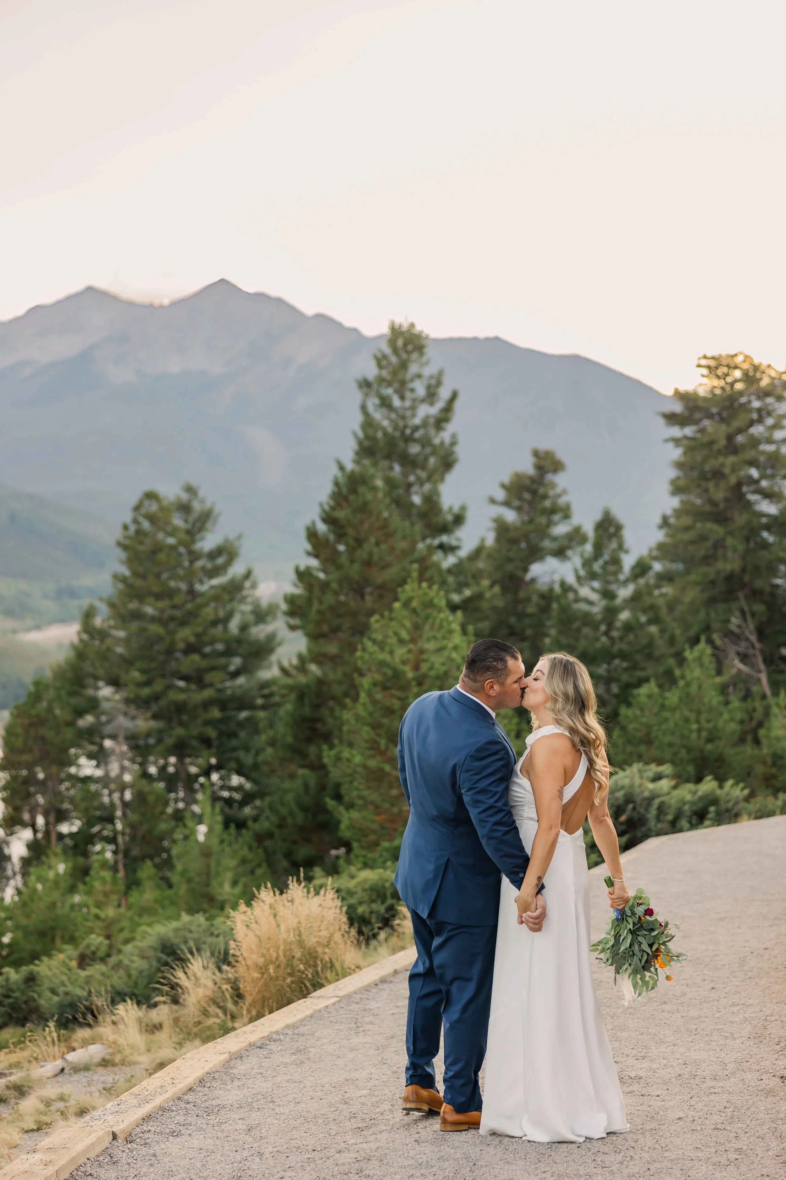 35_bride-and-groom-kiss-during-wedding-portraits-at-colorado-micro-wedding.jpg
