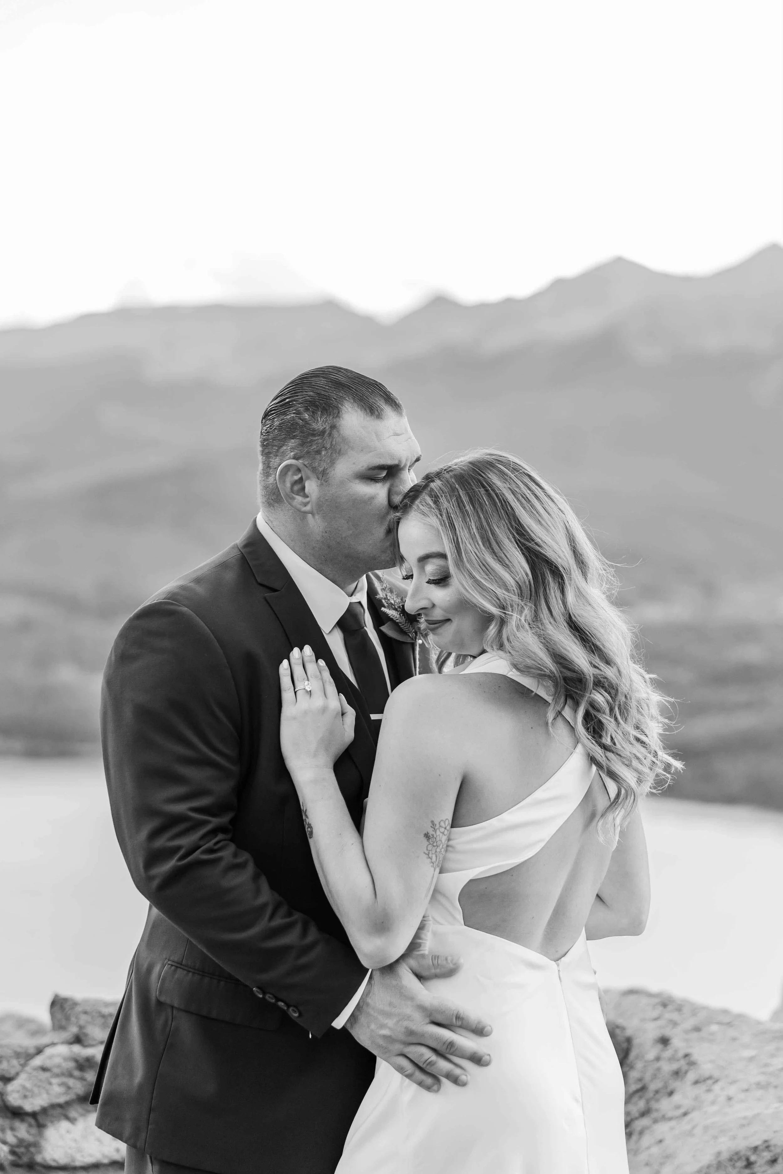 33_bride-and-groom-share-a-moment-overlooking-mountains-sapphire-point.jpg