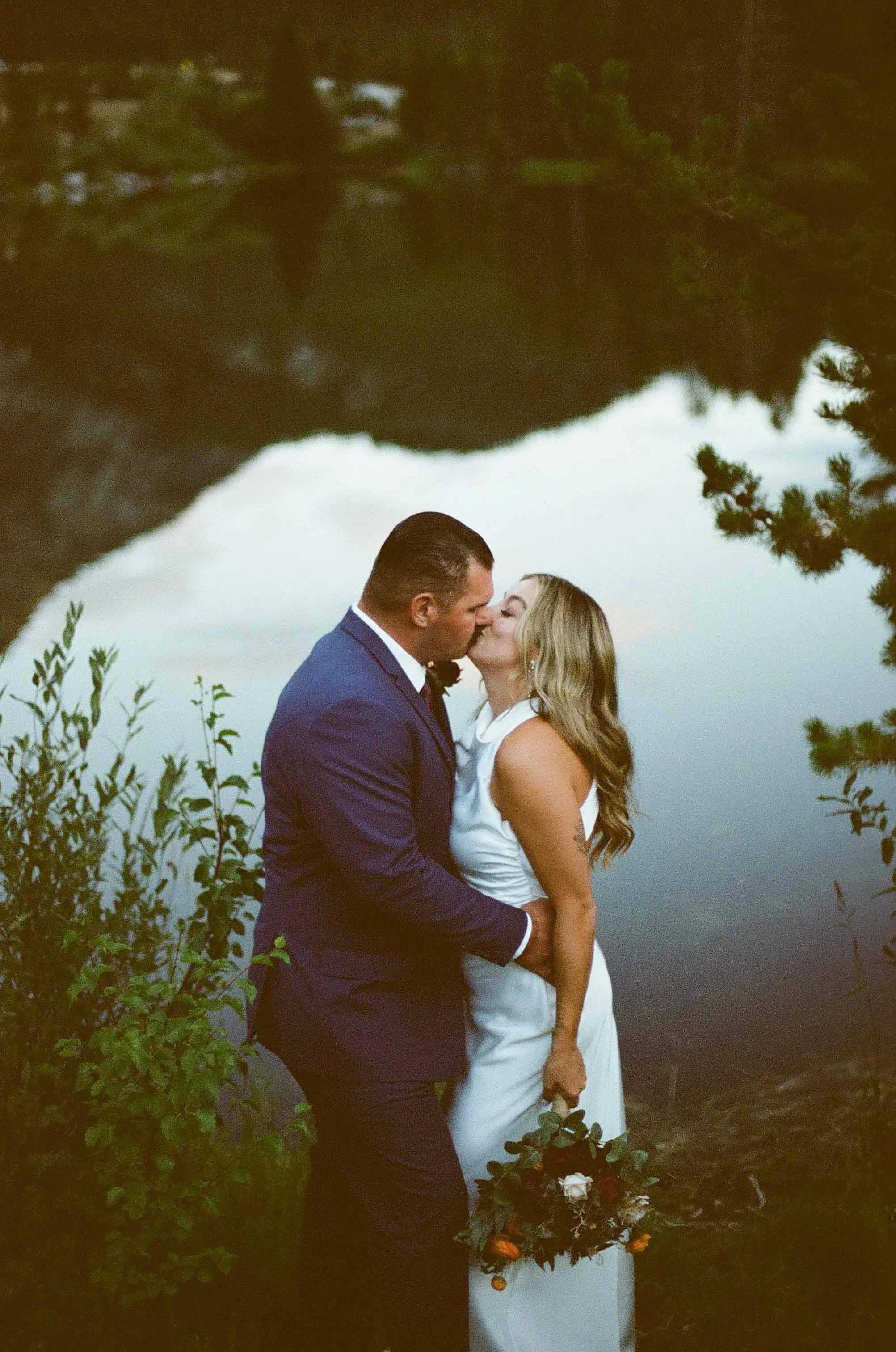 40_bride-and-groom-kiss-following-micro-wedding-in-colorado-mountains.jpg