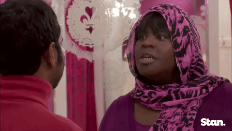 A gif from the show Parks and Rec of Donna saying "treat yo self" and Tom reacting with a smile