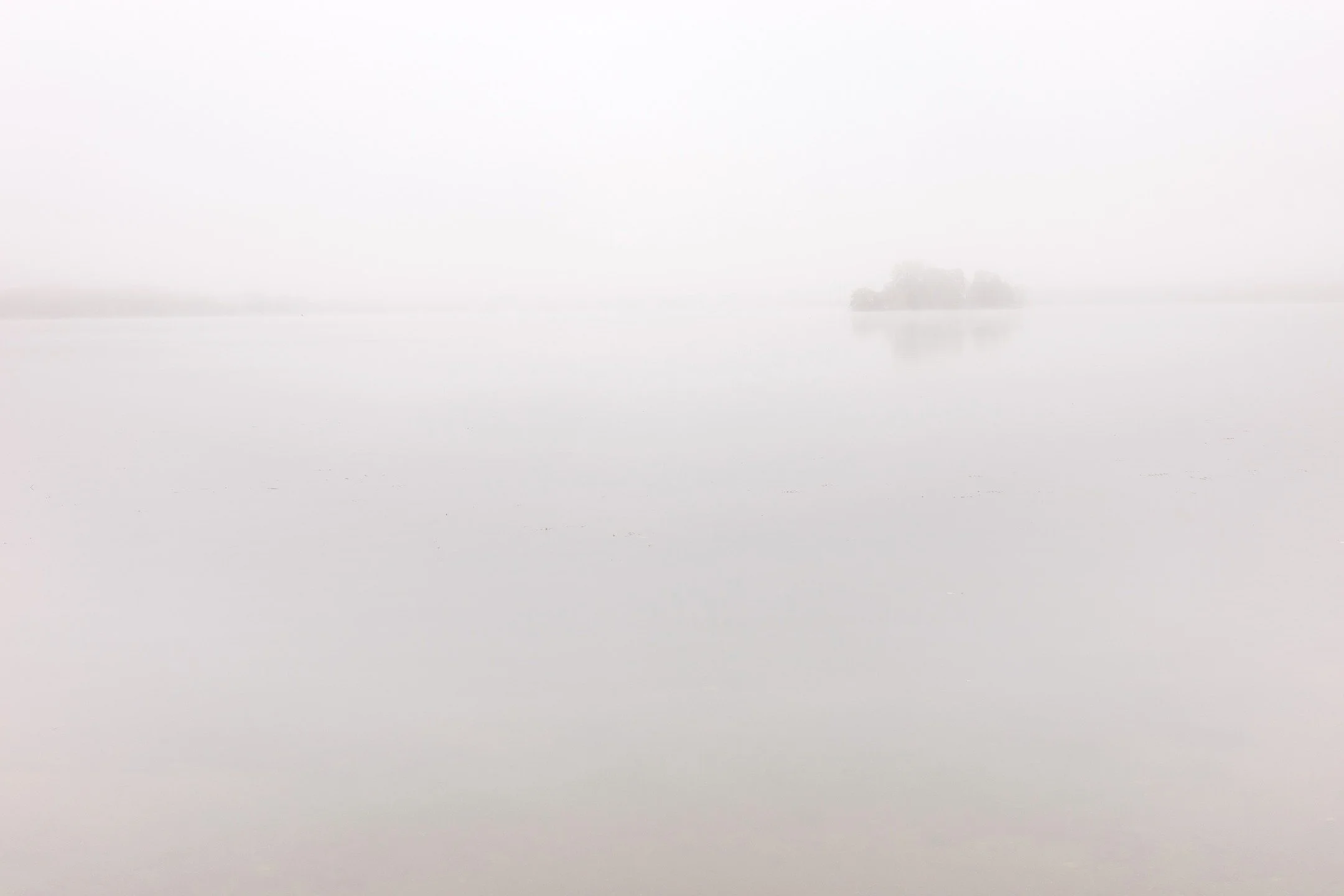 Foggy morning on Bald Eagle Lake. Very minimalist photos.
There is something beautiful in the still, quiet, peaceful, and reflective nature of a world blanketed in fog.
I think I like the image with the island at the top better, but I'm not sure.